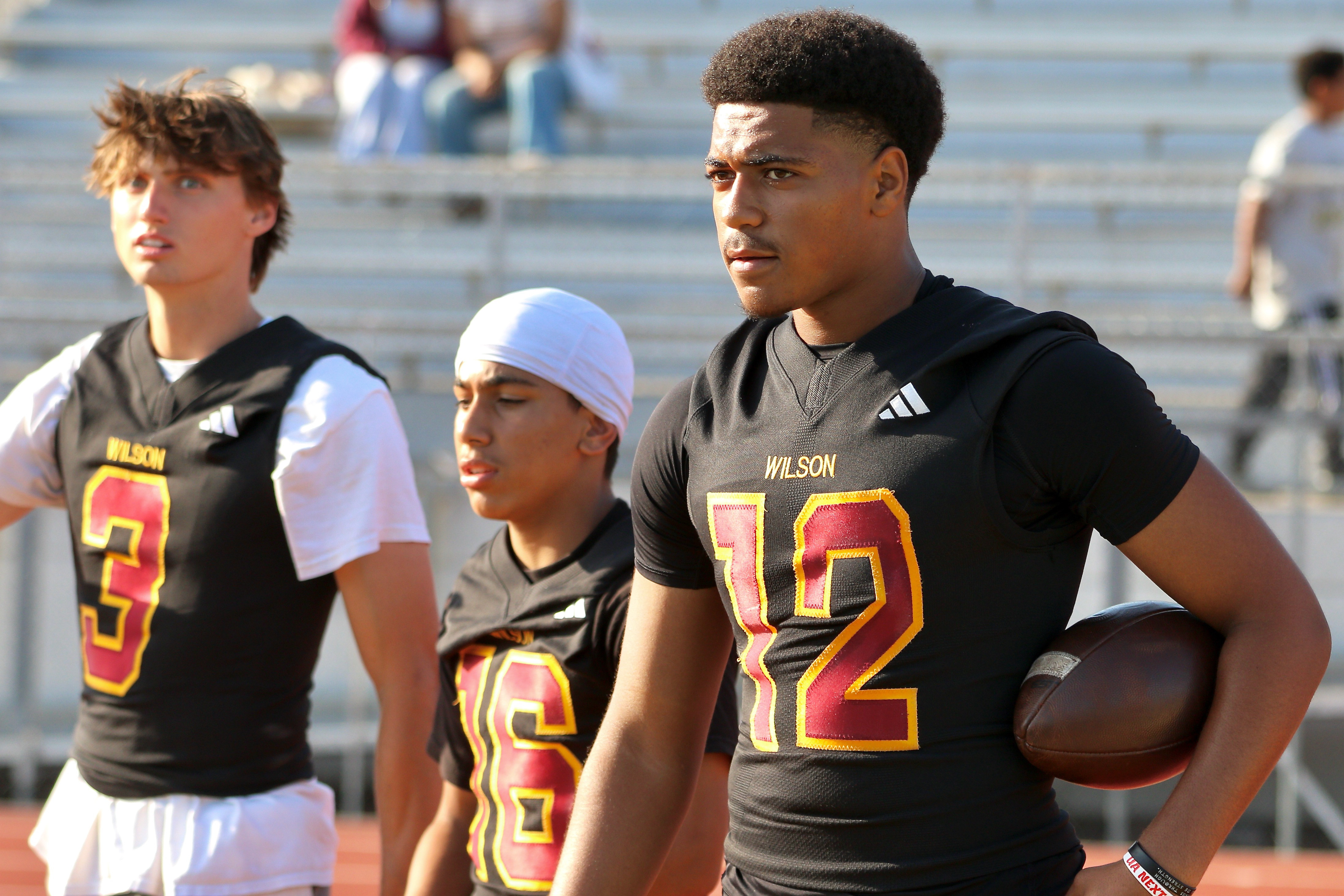 Wilson quarterback Jacob Powell takes part in a spring football...