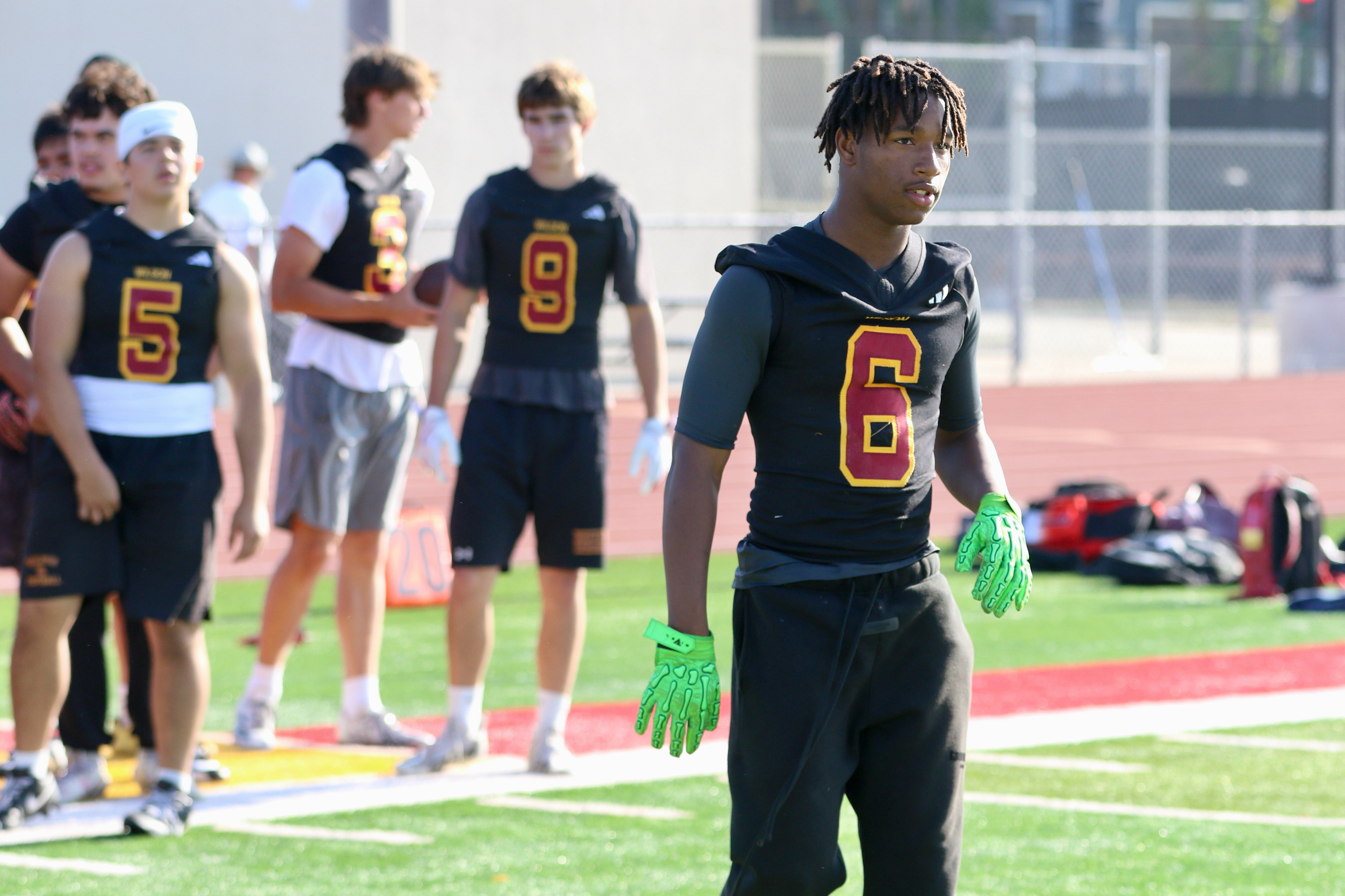 Wilson receiver and defensive back Kyle Harris takes part in...