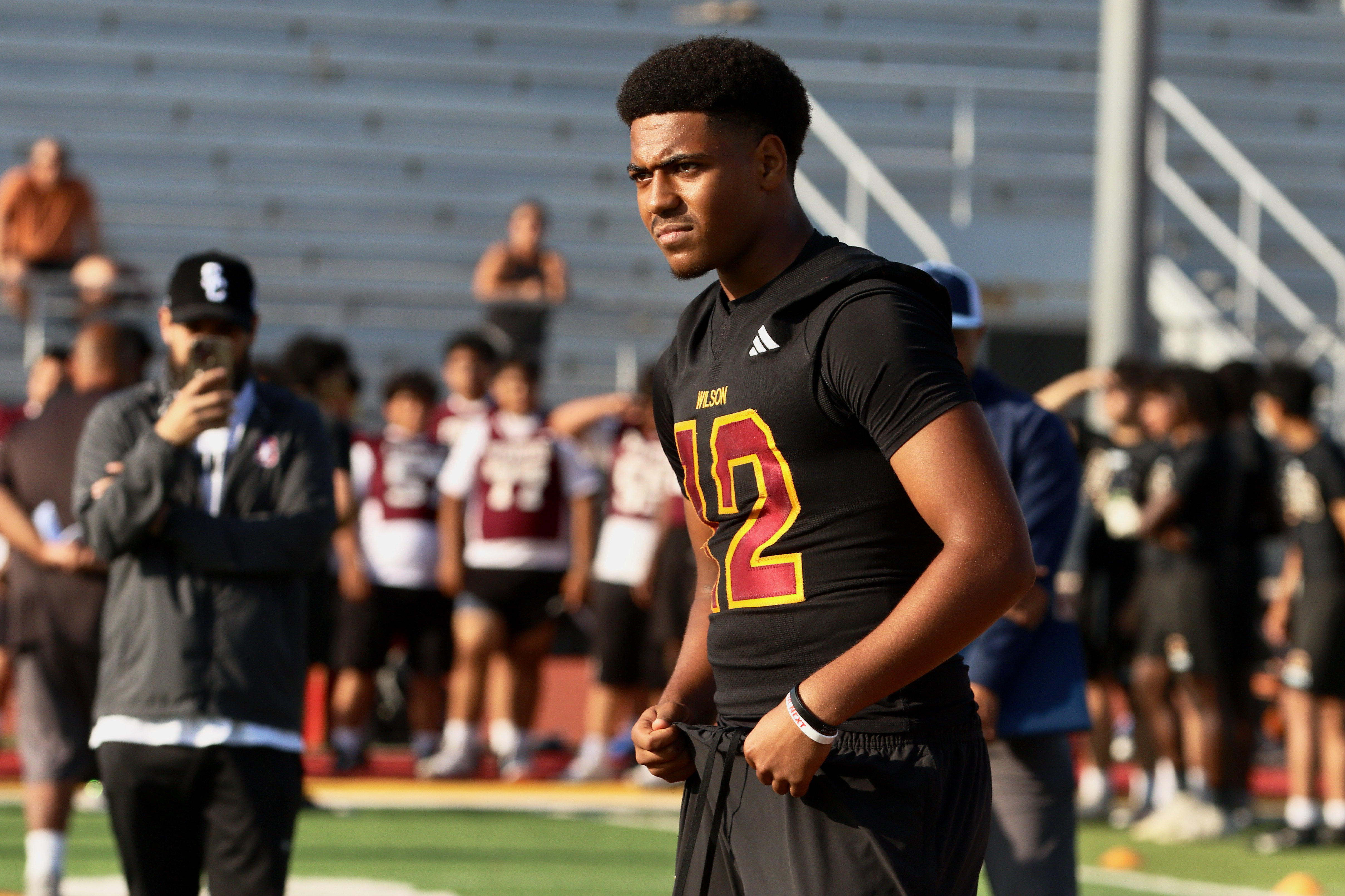 Wilson quarterback Jacob Powell takes part in a spring football...