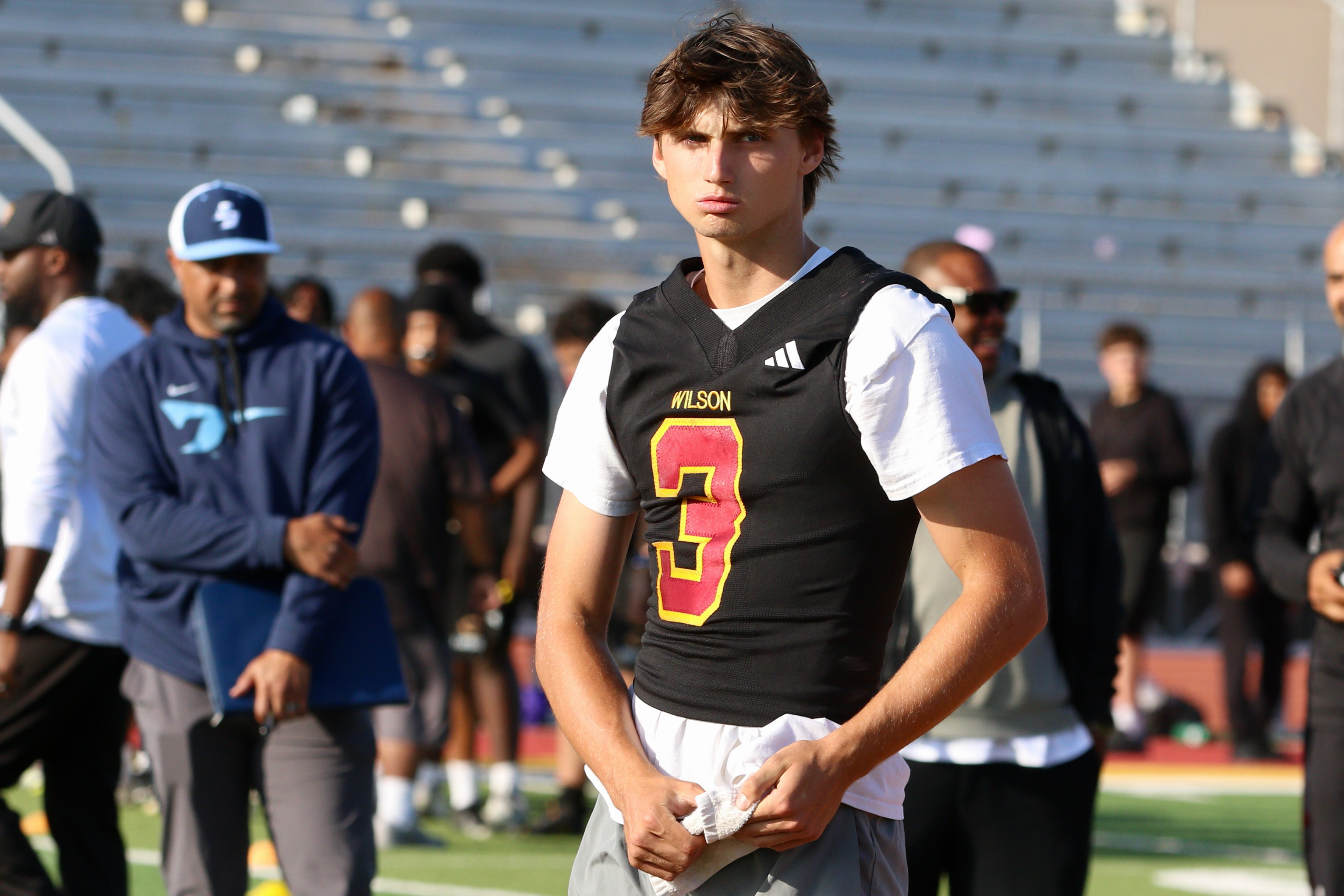 Wilson quarterback Logan Trafas participates in a spring football showcase...