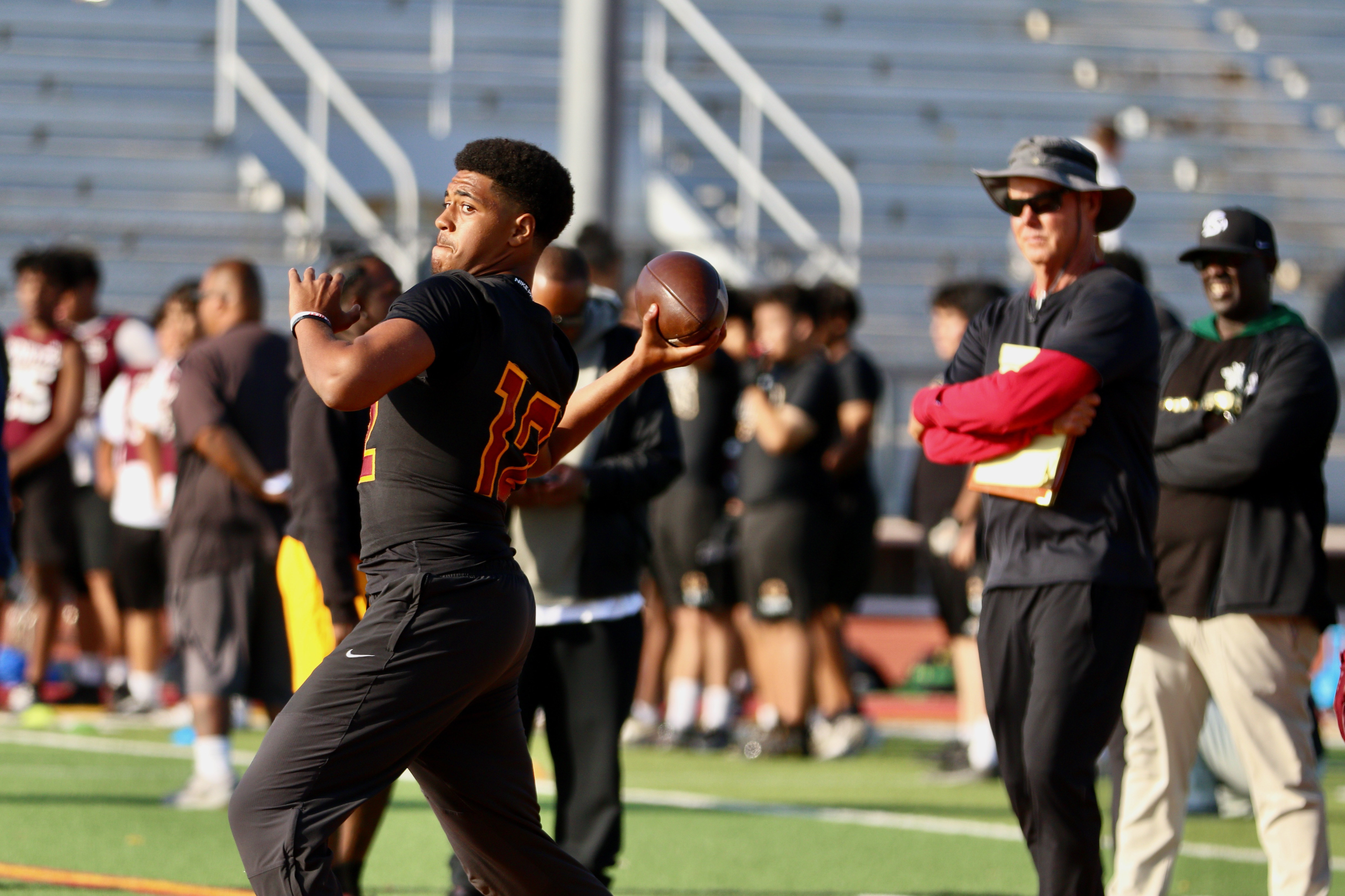Wilson quarterback Jacob Powell throws a pass during a spring...