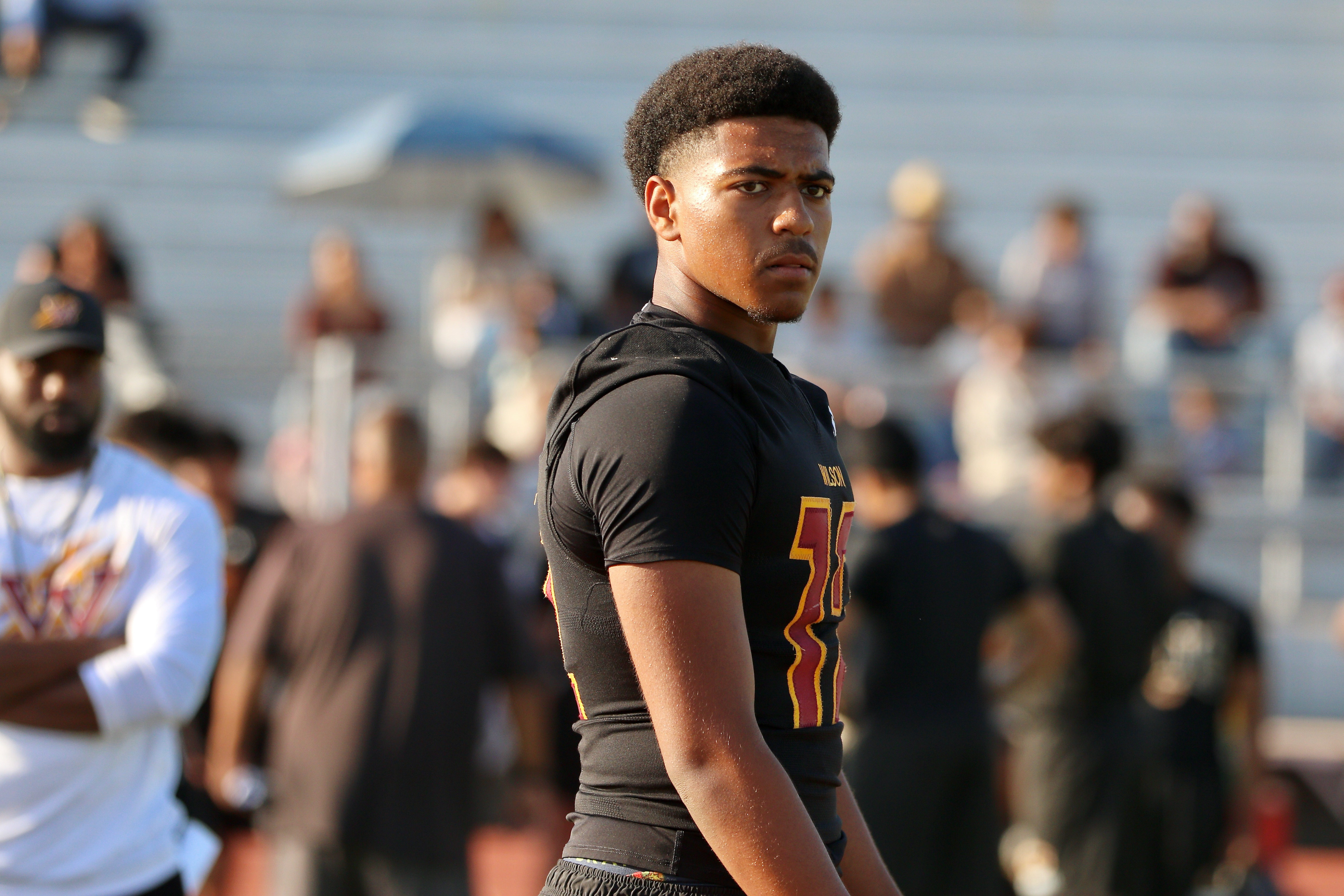 Wilson quarterback Jacob Powell takes part in a spring football...