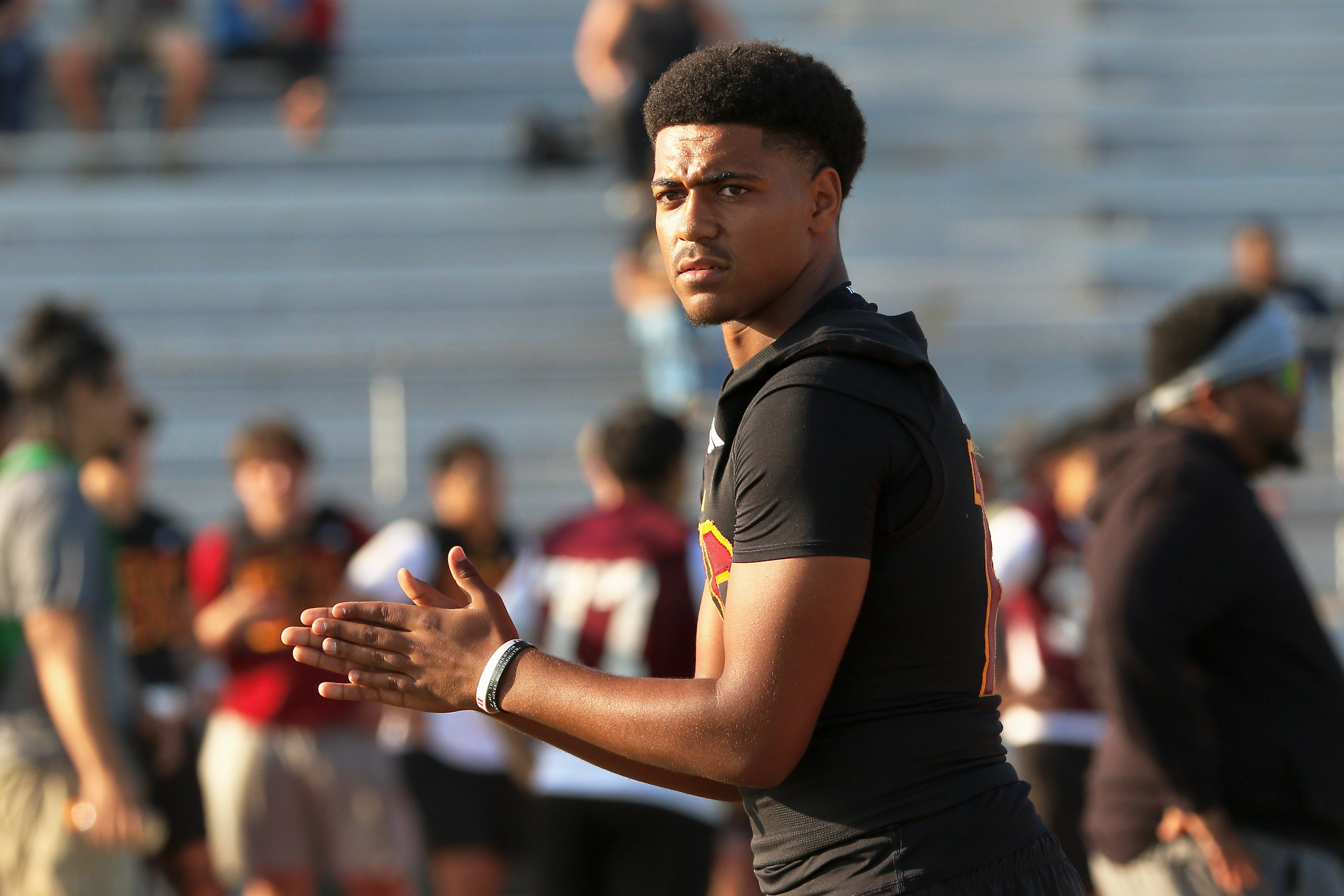 Wilson quarterback Jacob Powell takes part in a spring football...