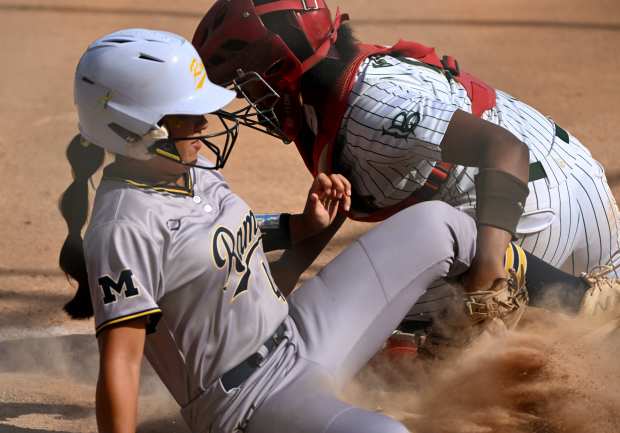 Lauryn Kim #48 of Millikan scores past catcher Janelle Morris #5 of Long Beach Poly in the fourth inning of a prep softball game at El Dorado Park West in Long Beach on Thursday, April 16, 2026. (Photo by Keith Birmingham, Pasadena Star-News/ SCNG)