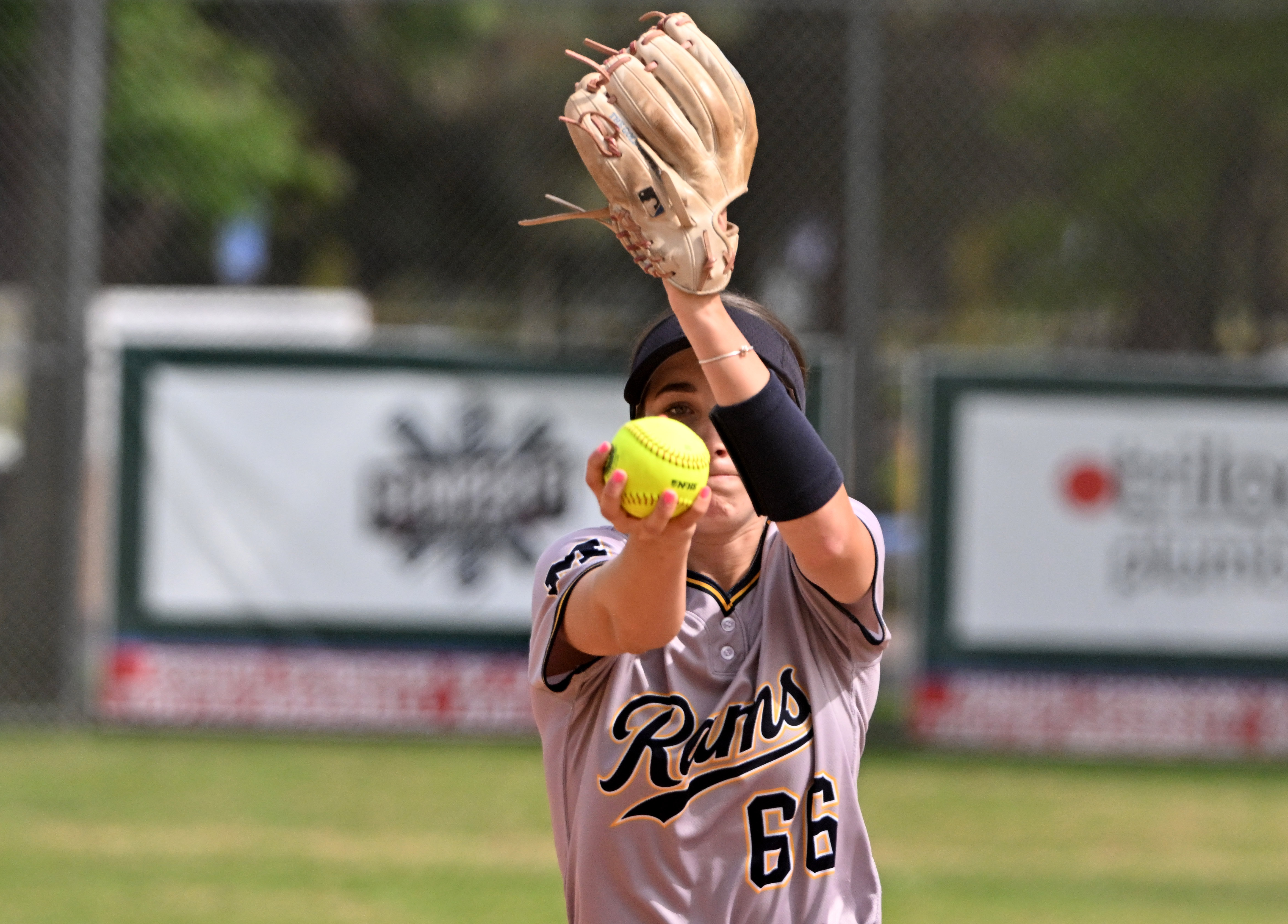 Starting pitcher Riley McAndrew #66 of the Millikan Rams throws...