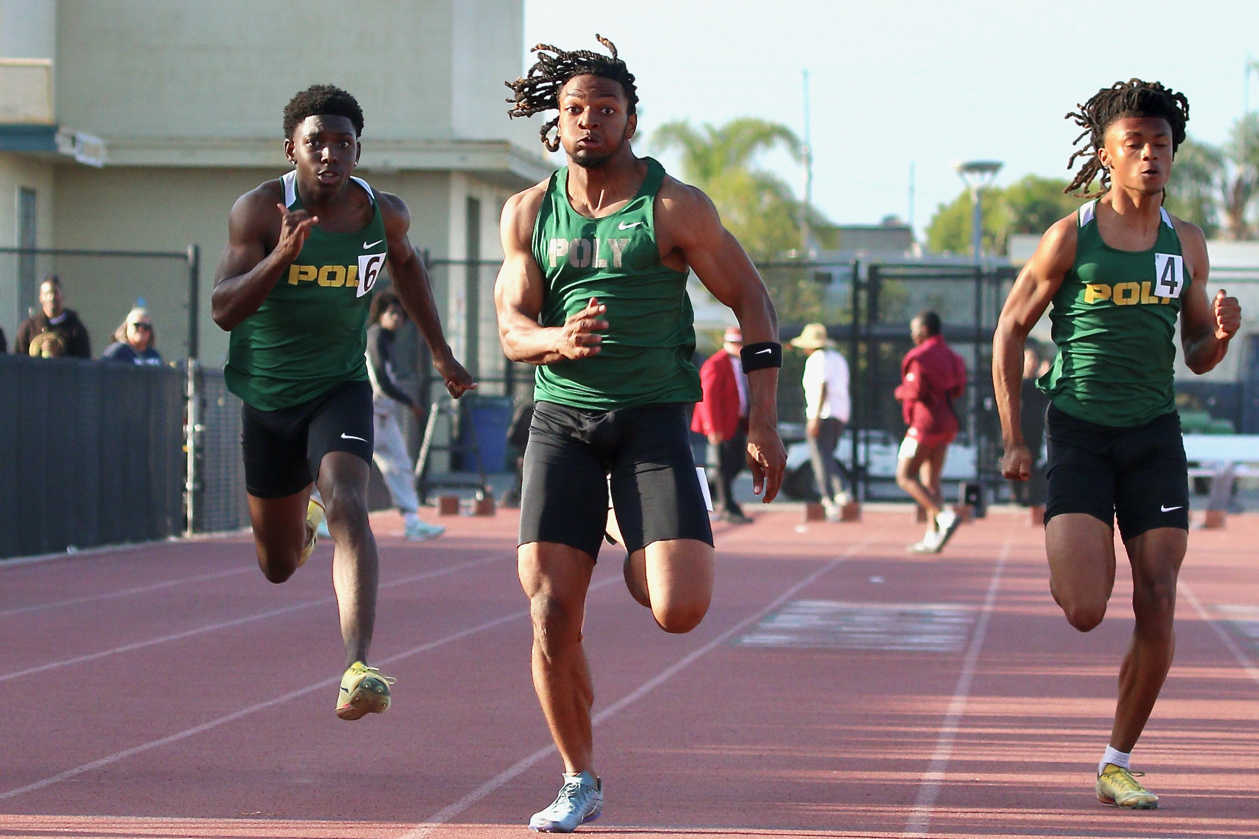 Polyâs Malachi Dawson bursts through to win the boyâs 100-meter...