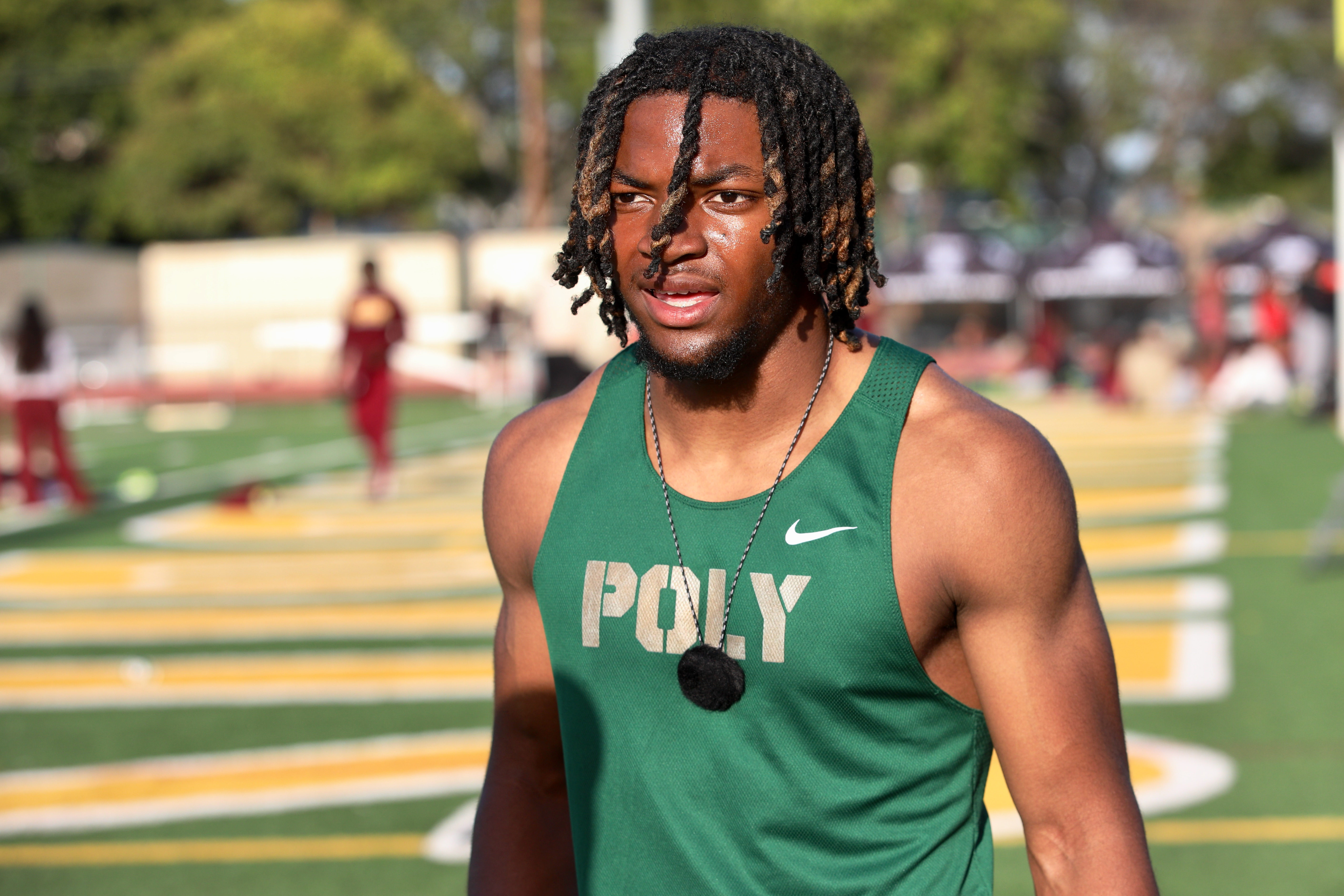 Polyâs Malachi Dawson finished first in the boyâs 100-meter dash...
