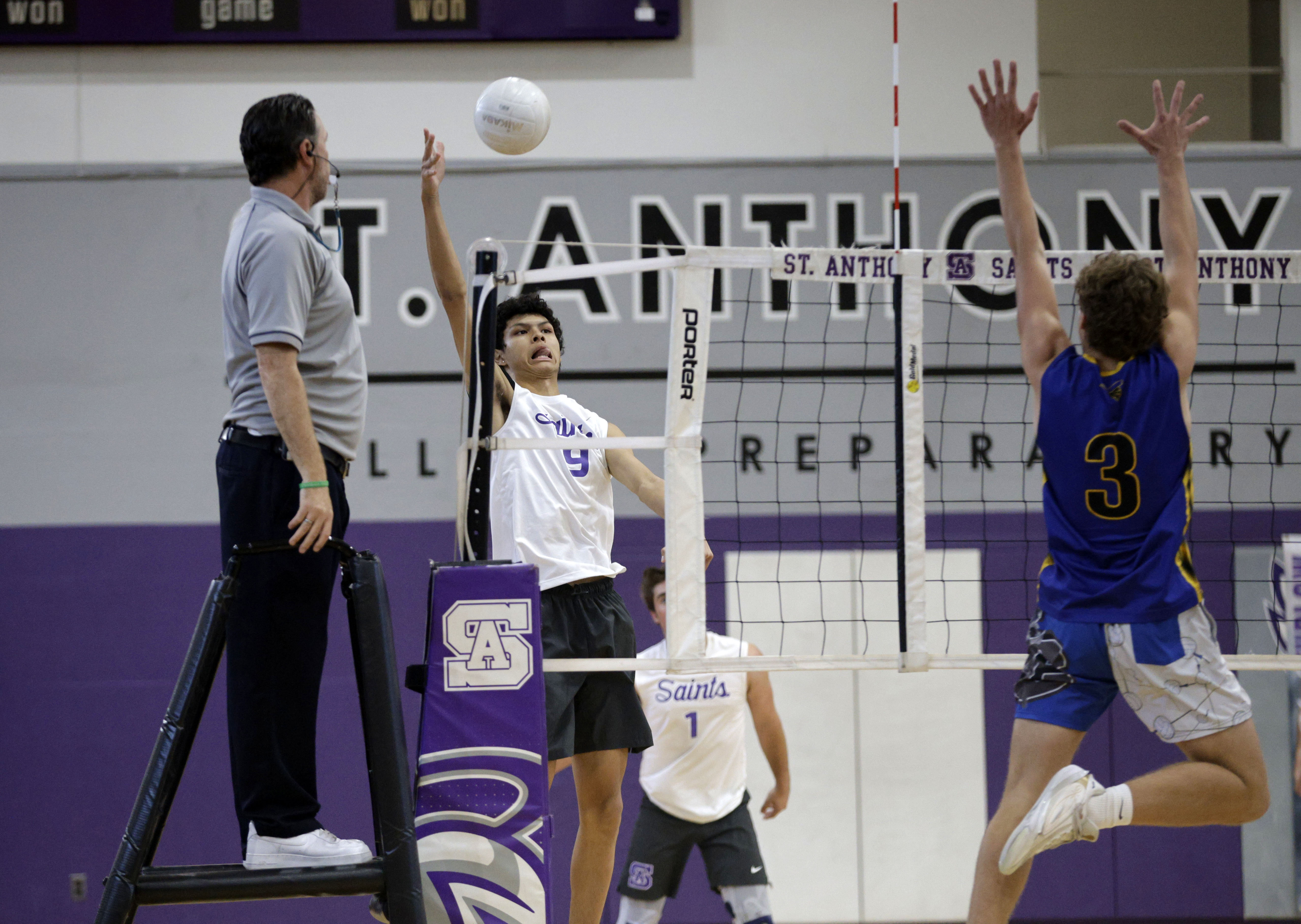 St. Anthony’s Griffin Bass (9) looks to hit the ball...