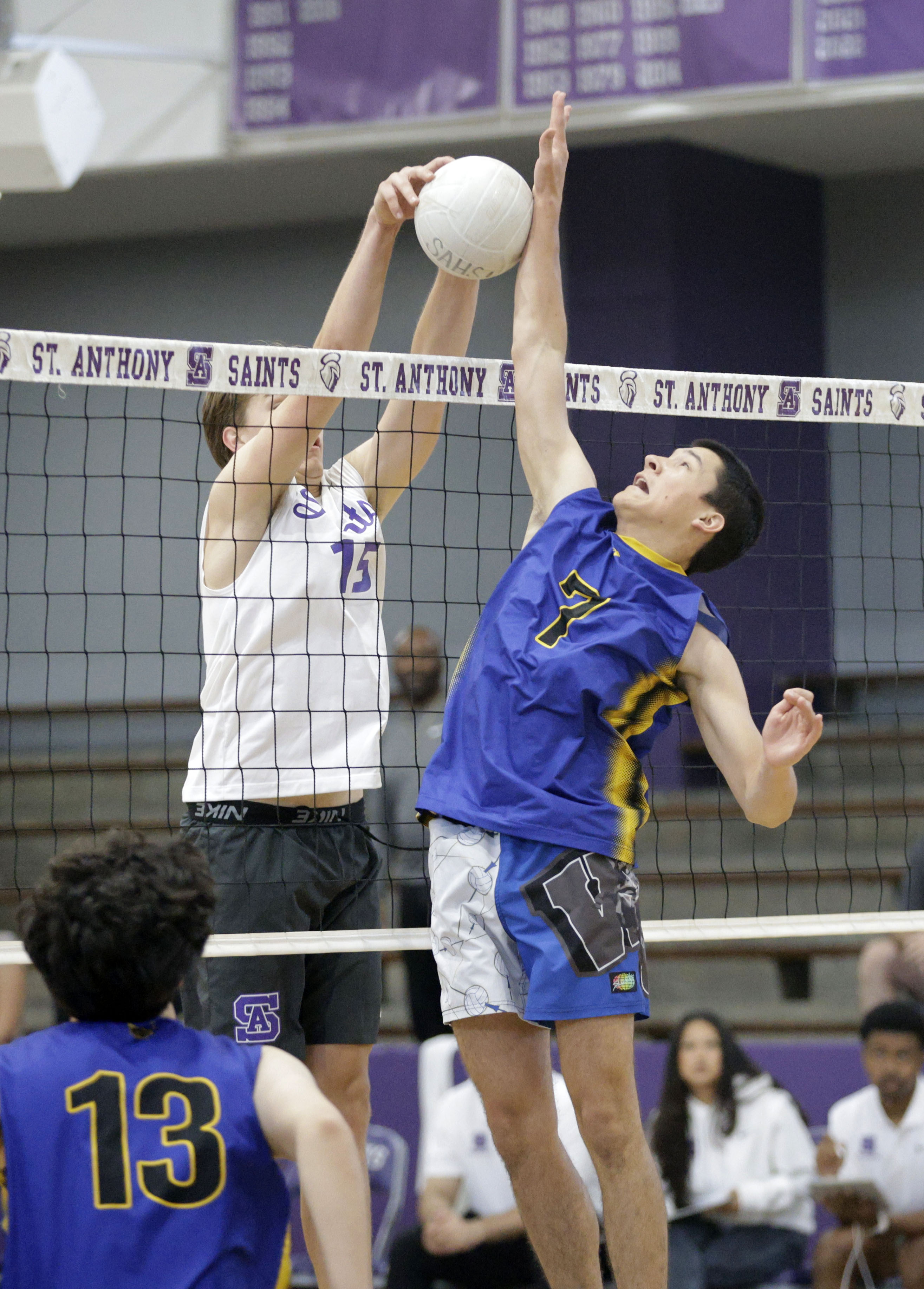 St. Anthony’s Austin Luckey (15) tries to push the ball...