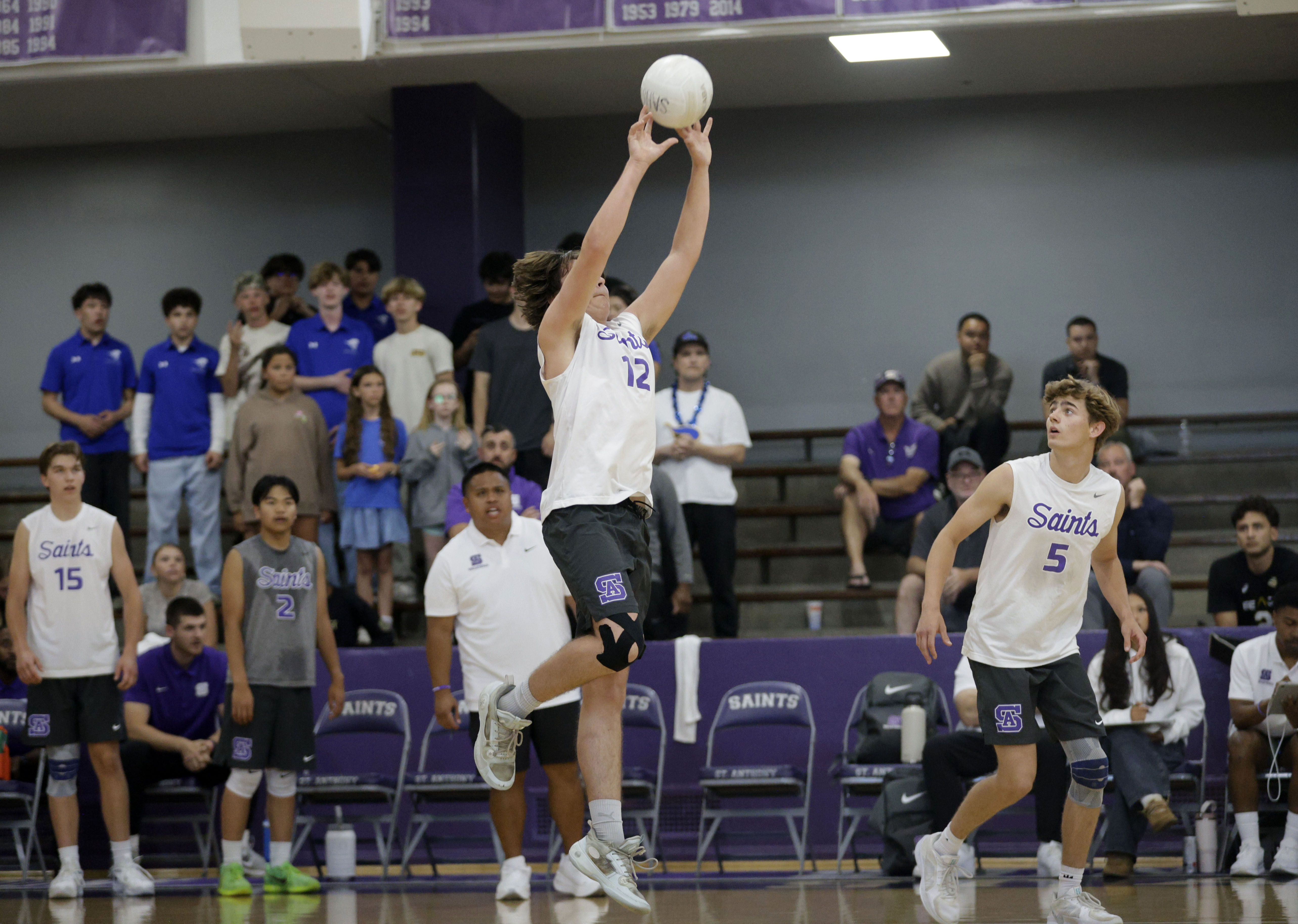 St. Anthony’s Benji Bean (12) sets up the ball as...