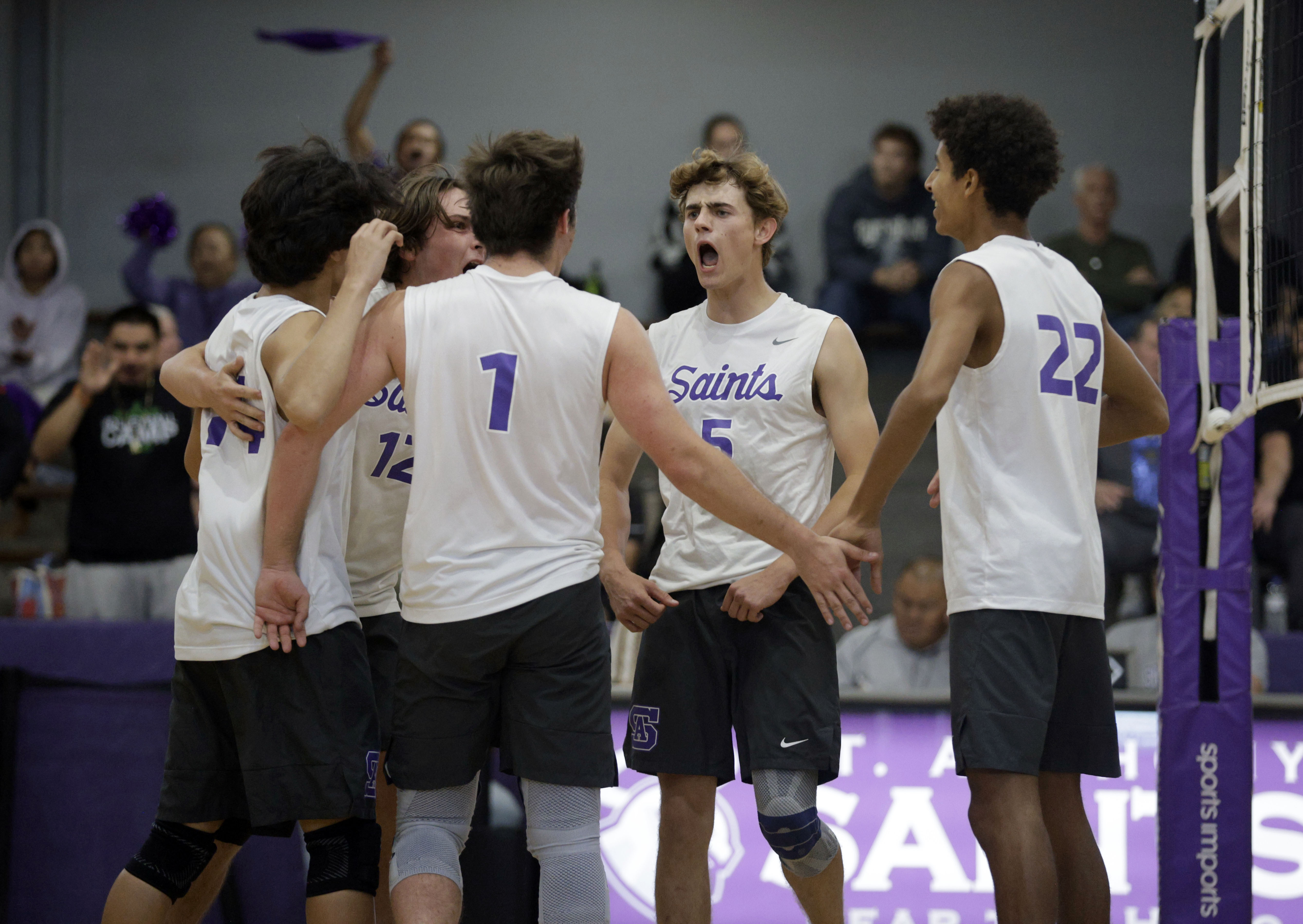 St. Anthony’s Jack Furlow (5) celebrates with his teammates as...