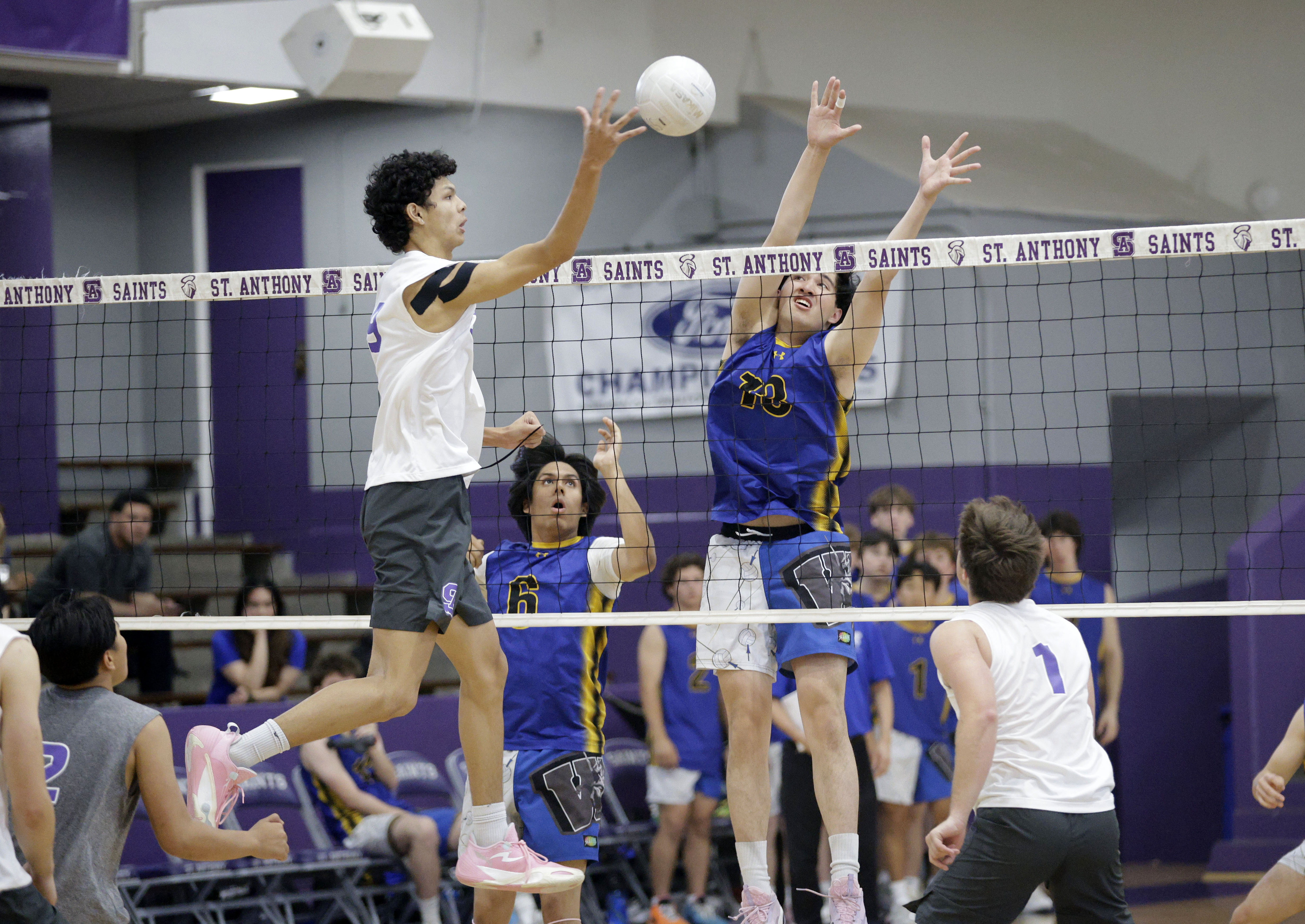 St. Anthony’s Griffin Bass (9) tries to hit the ball...