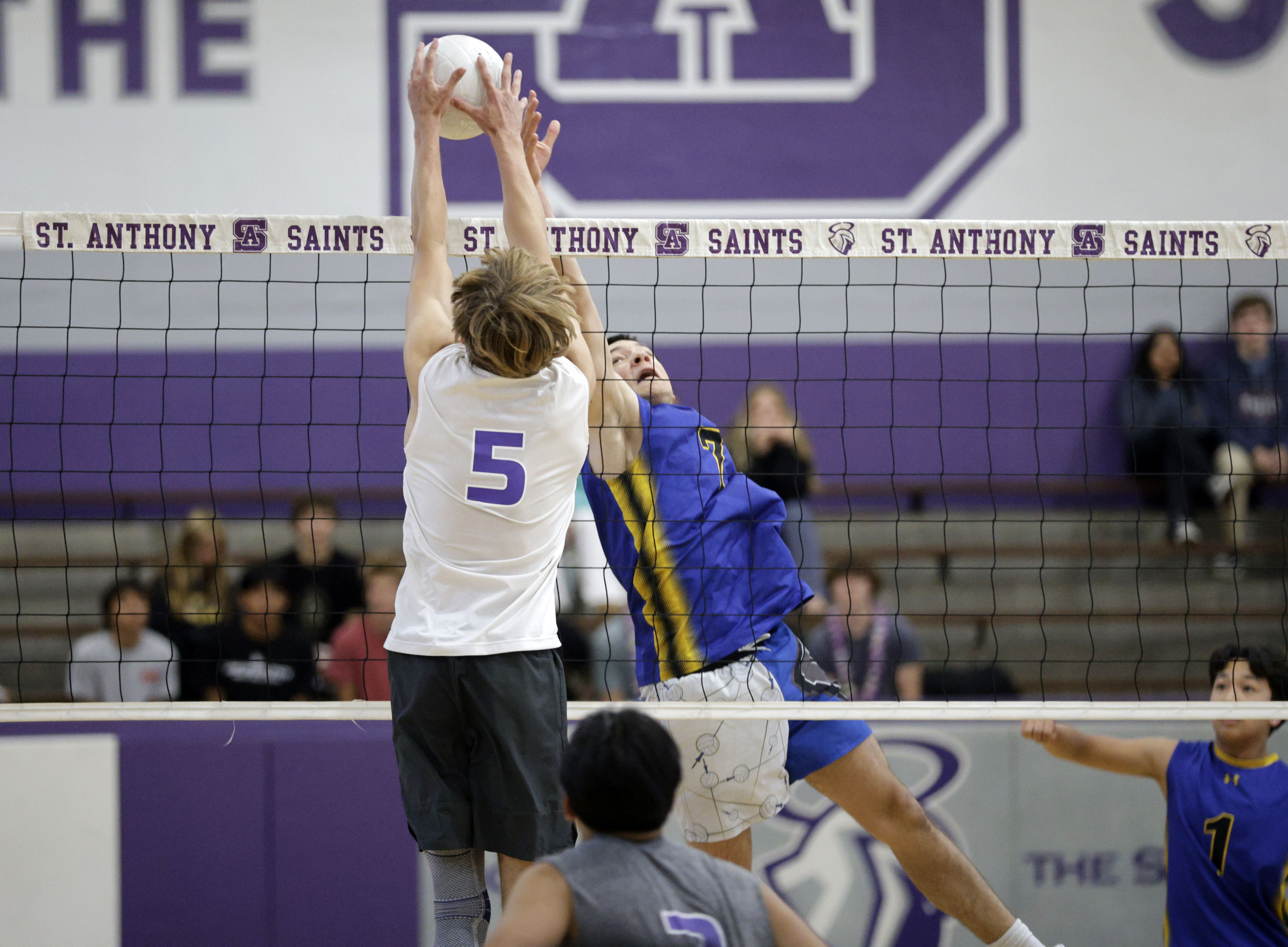 St. Anthony’s Jack Furlow (5) blocks the ball from Western...