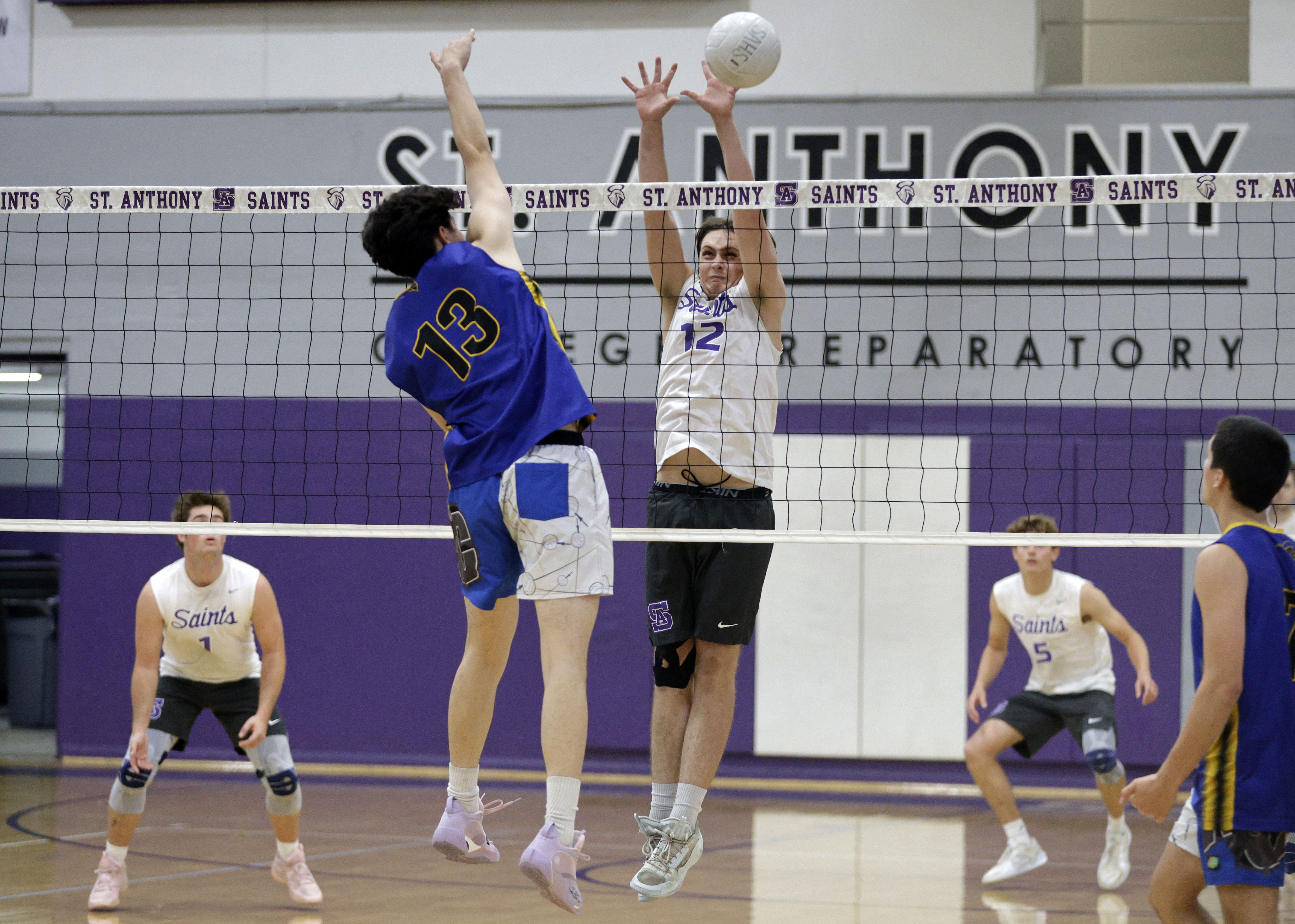 St. Anthonys Benji Bean (12) tries to block the ball...