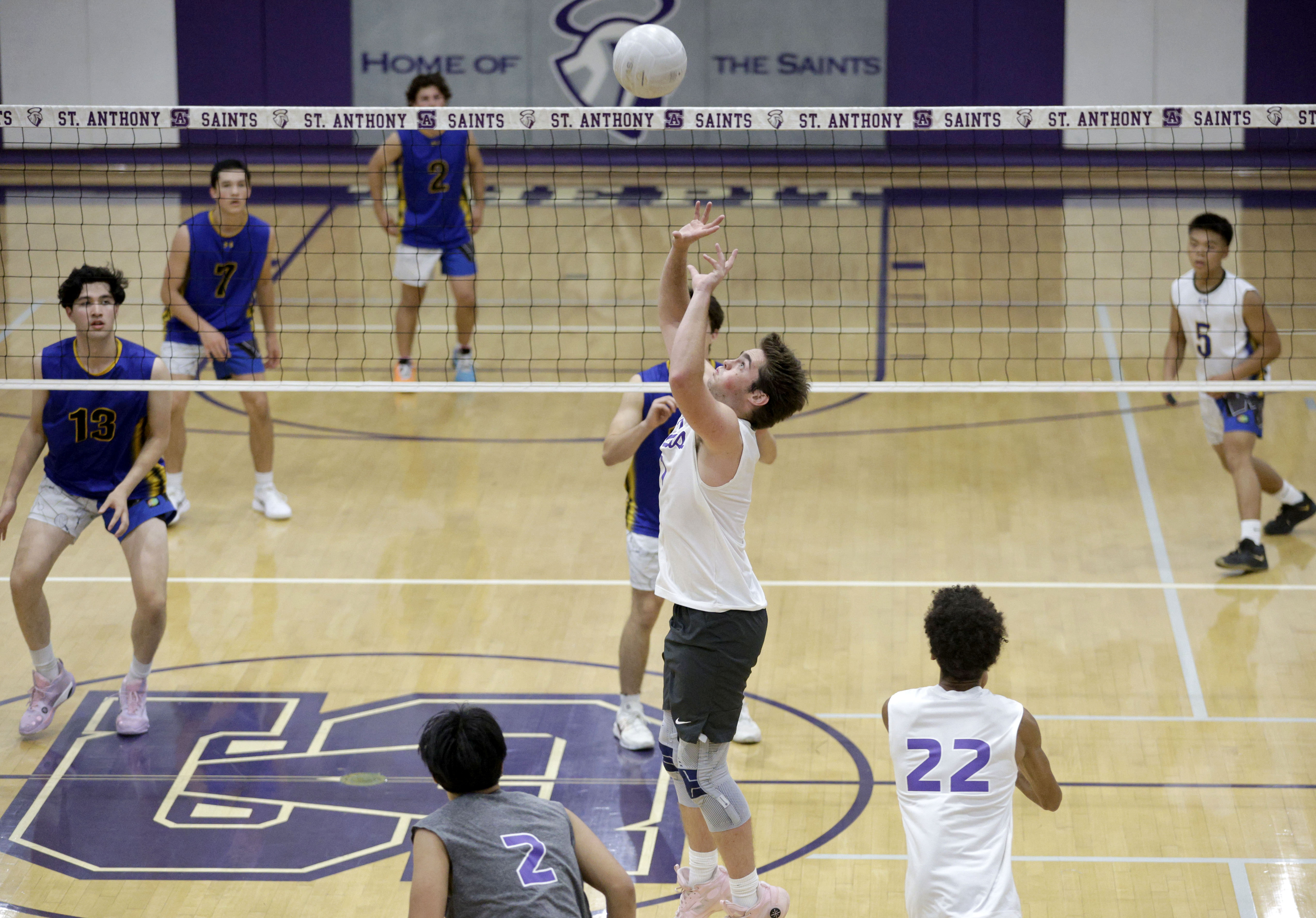 St. Anthony’s Noah Furlow (1) set the ball up as...