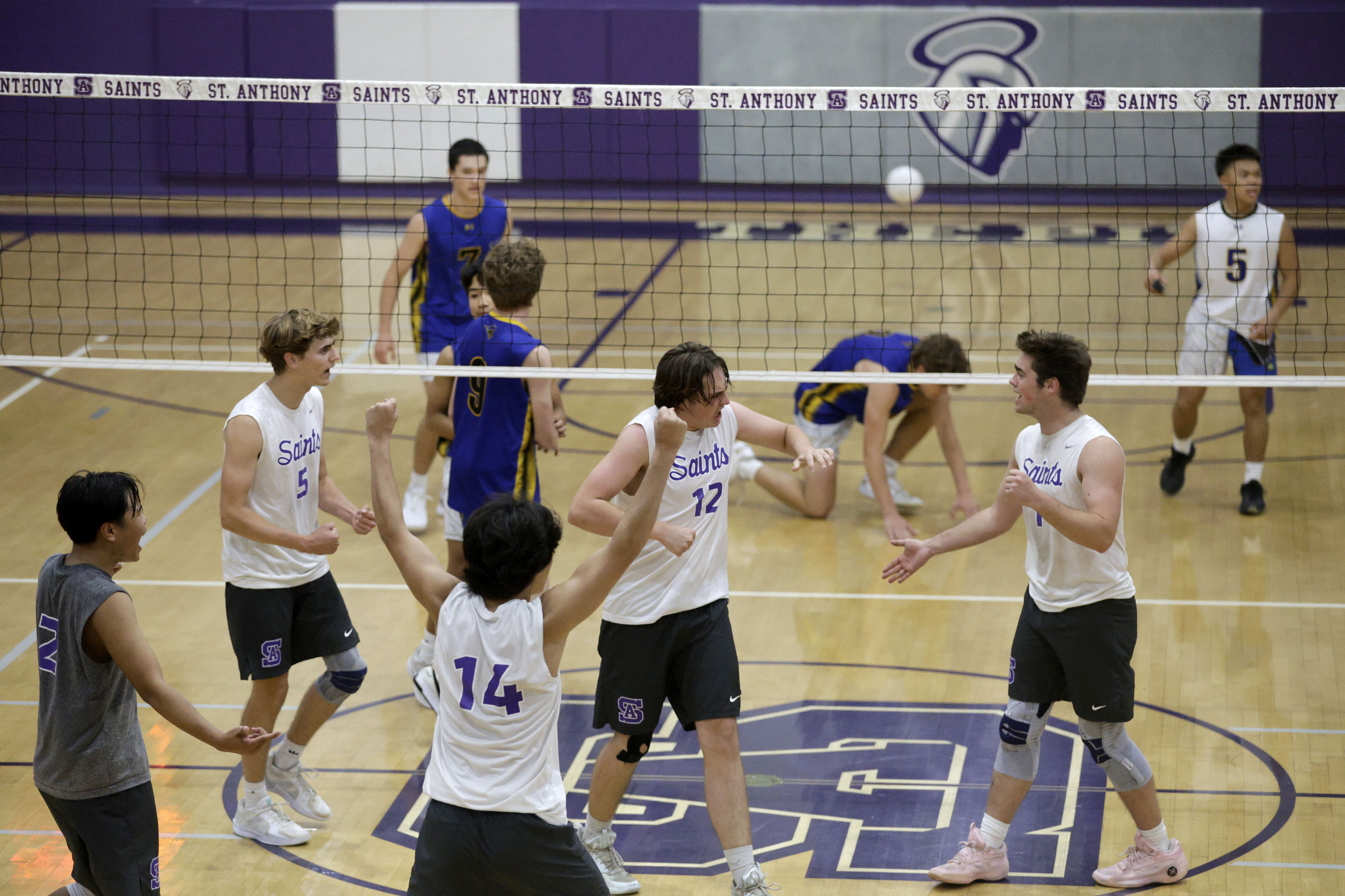 St. Anthony’s players celebrate as they take down Western Christian...