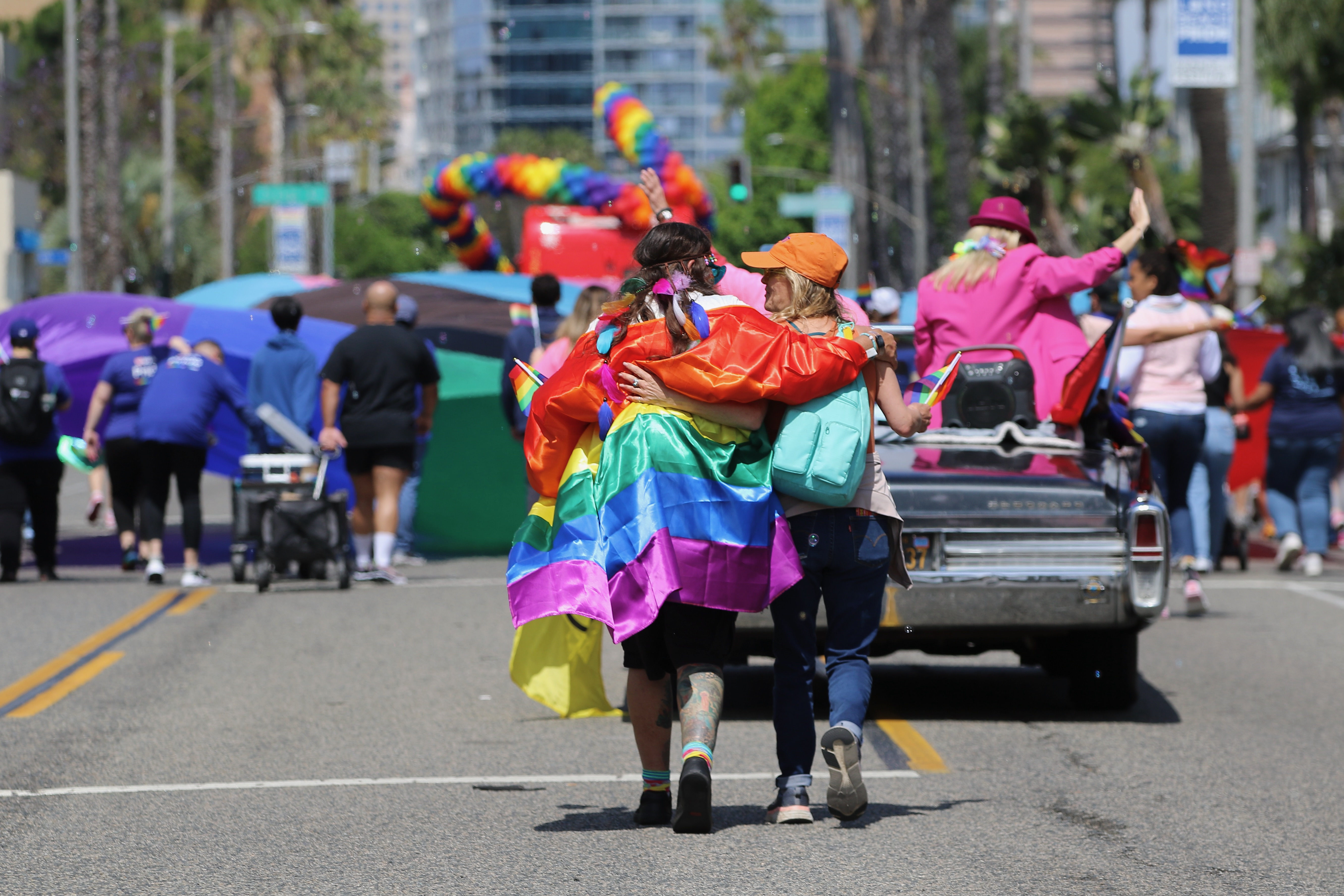 Participants walk along Ocean Boulevard at the 41st Long Beach...