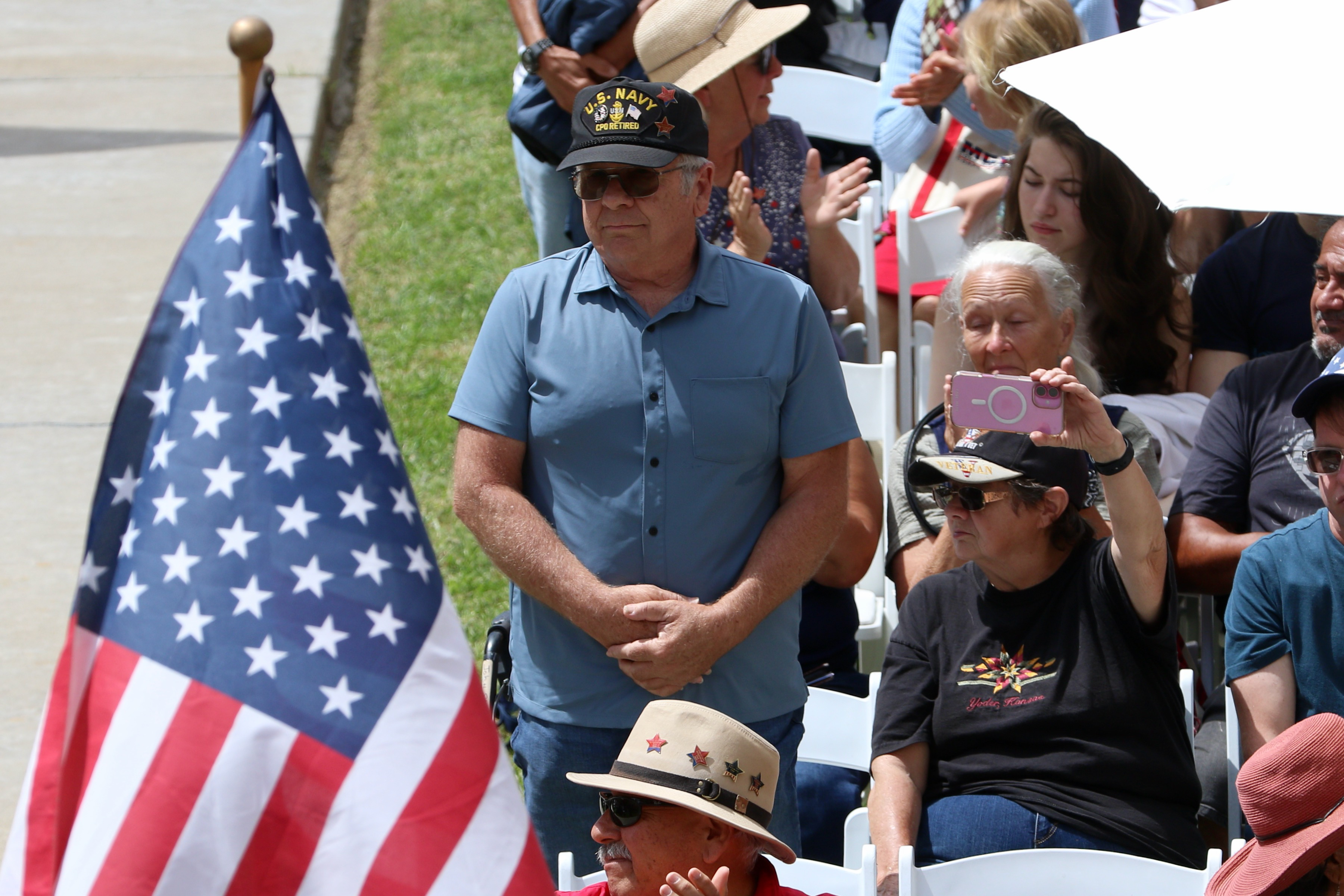 A U.S. Navy veteran is recognized during a Memorial Day...