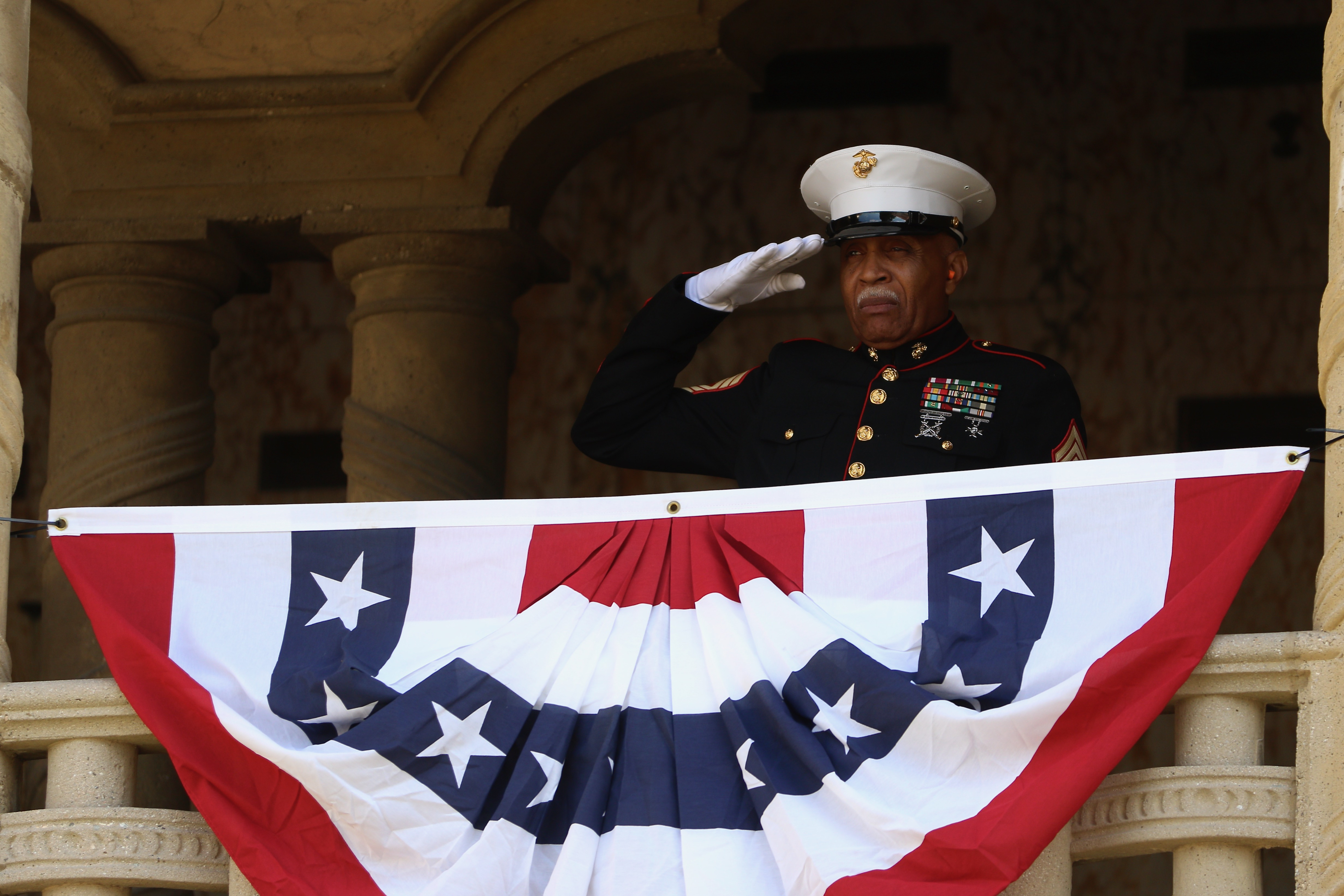 A member of the Semper Fi Honor Guard salutes during...