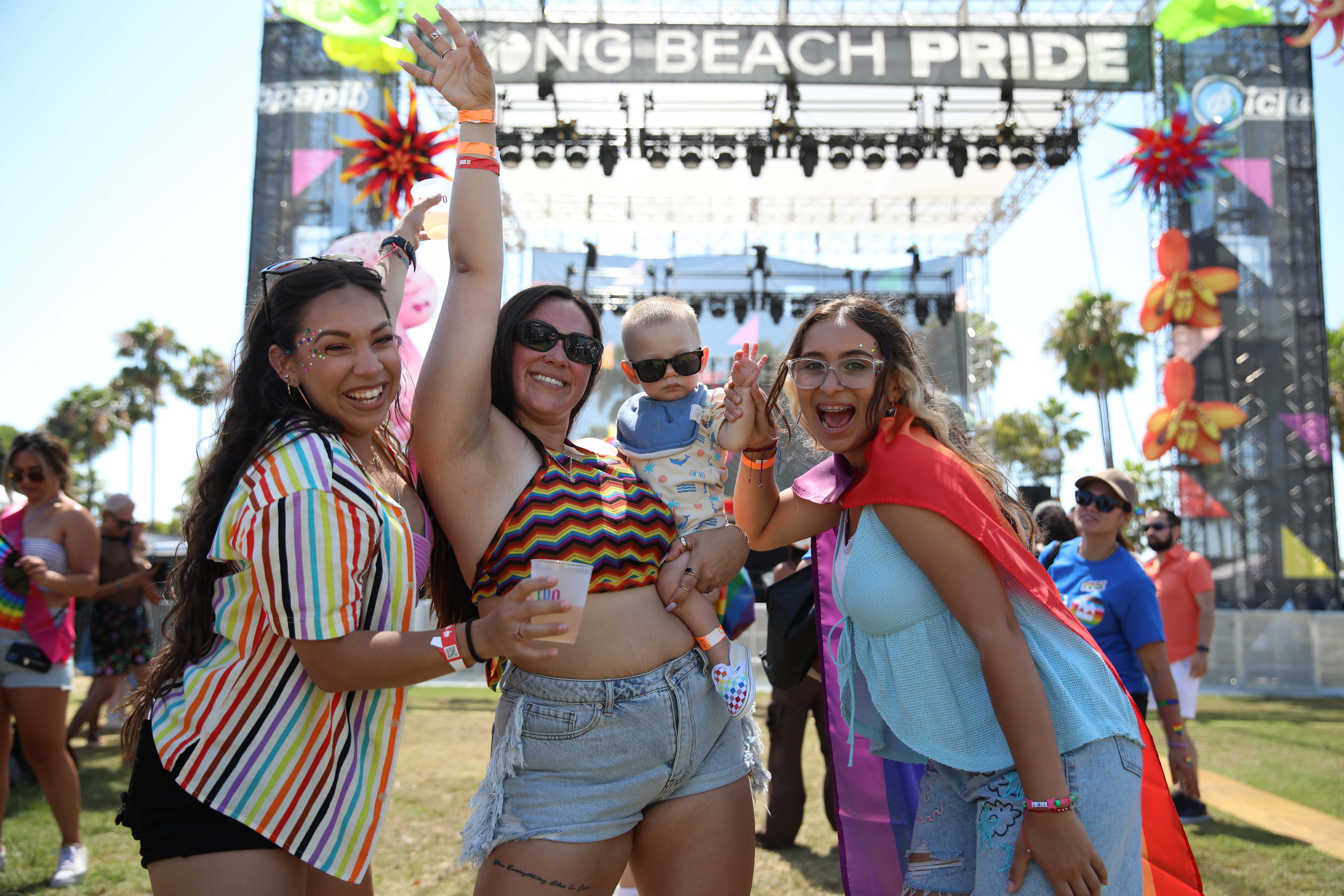 Attendees dance at the Long Beach Pride Festival on Saturday,...