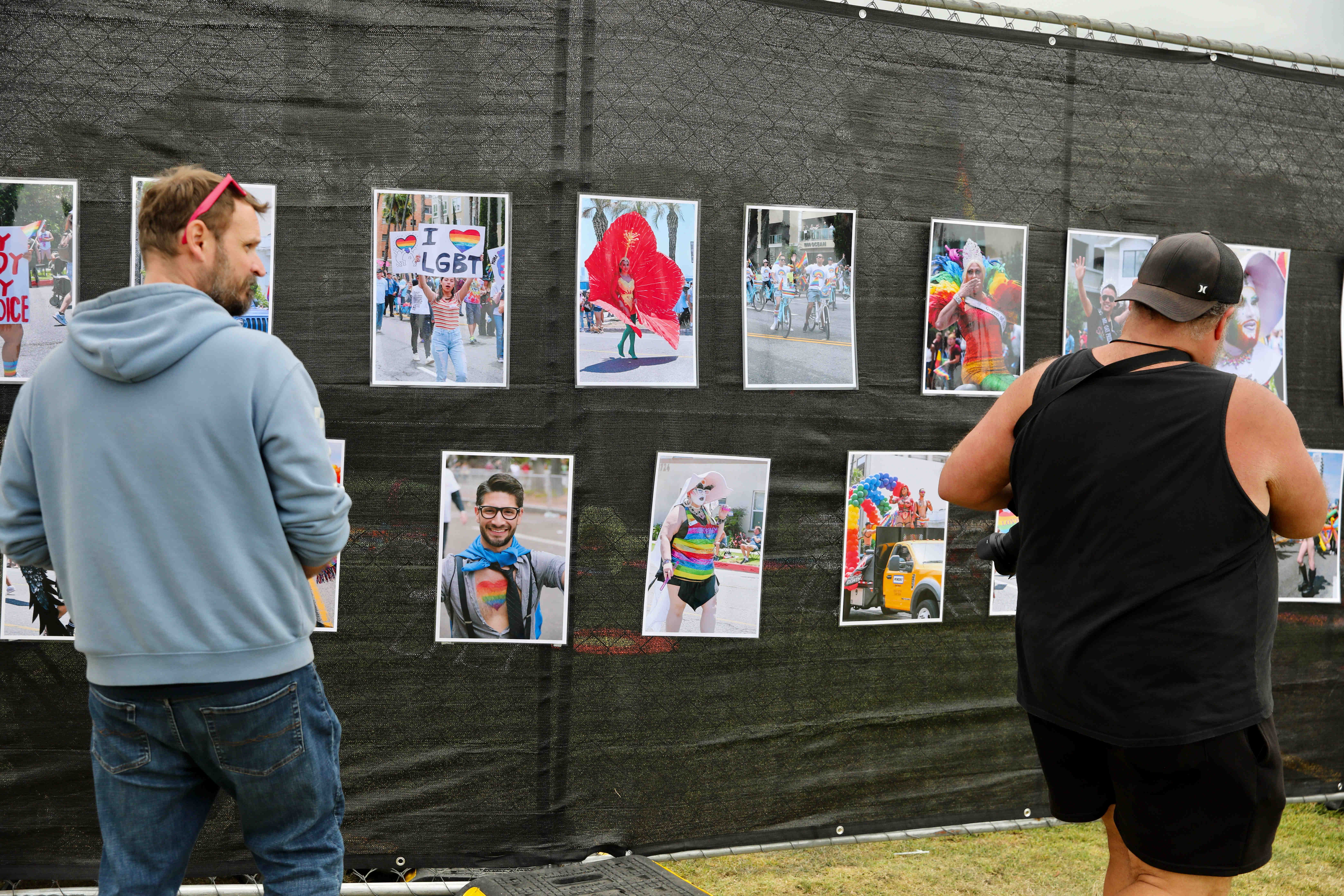 Attendees check out a photo exhibit at the Long Beach...