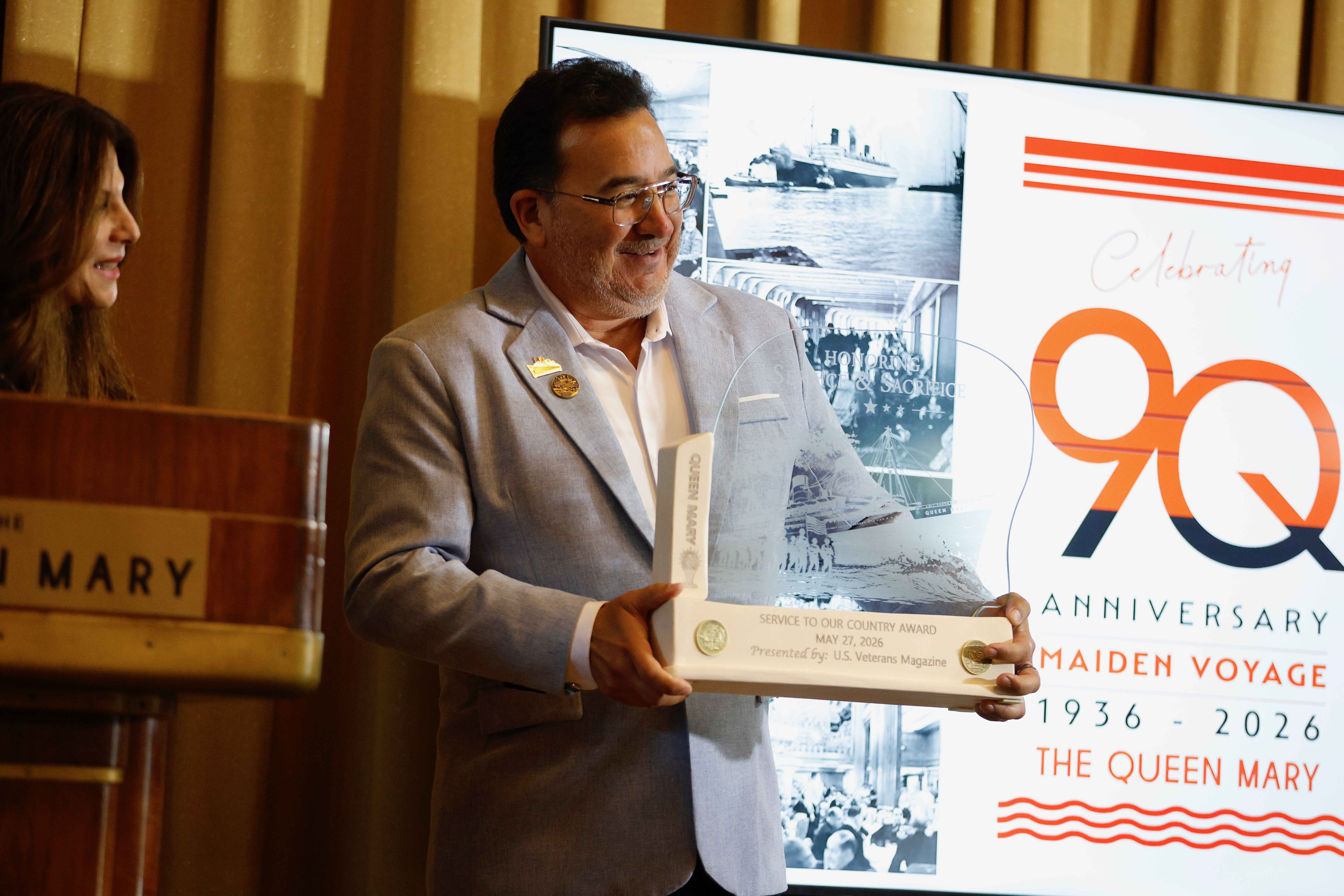 Queen Mary managing director Steve Caloca accepts an award recognizing...