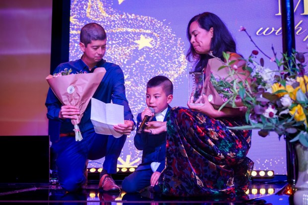 Catalyst Awardee Max Connors, center, with parents Casey, left, and Claire Connors during the WomenShelter of Long Beach's "Leading with Love" gala on May 7 at Ovation Square in downtown. (Courtesy photo)