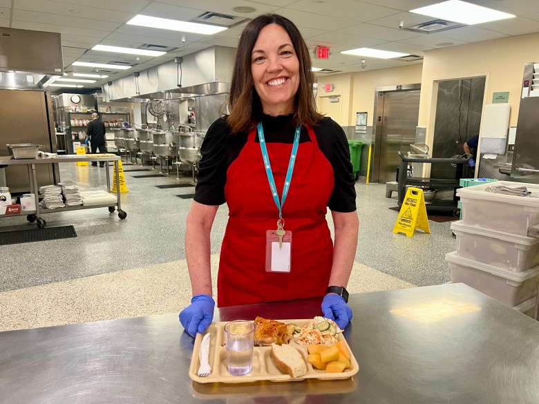 Woman holds a tray of food