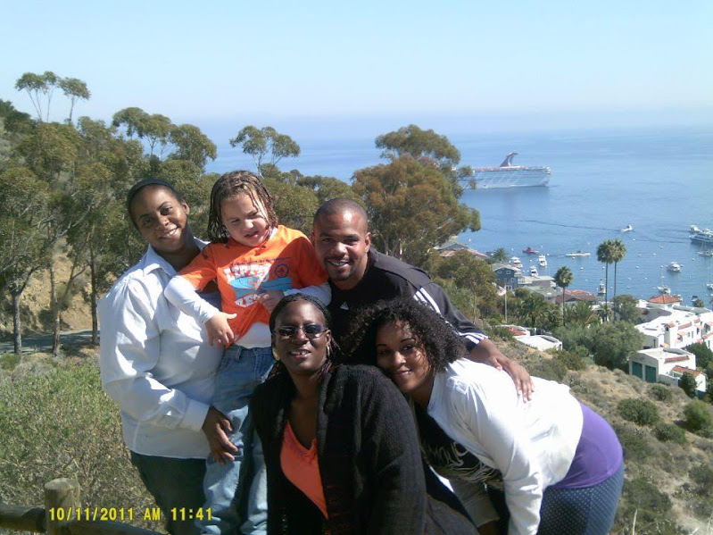Long poses for a photo with several of his family members.