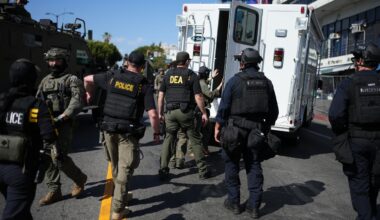 Drug Enforcement Administration (DEA) agents alongside other law enforcement officers work the scene near MacArthur Park after federal authorities made arrests on charges related to selling illicit drugs on Wednesday, May 6, 2026, in Los Angeles. (AP Photo/Jae C. Hong)
