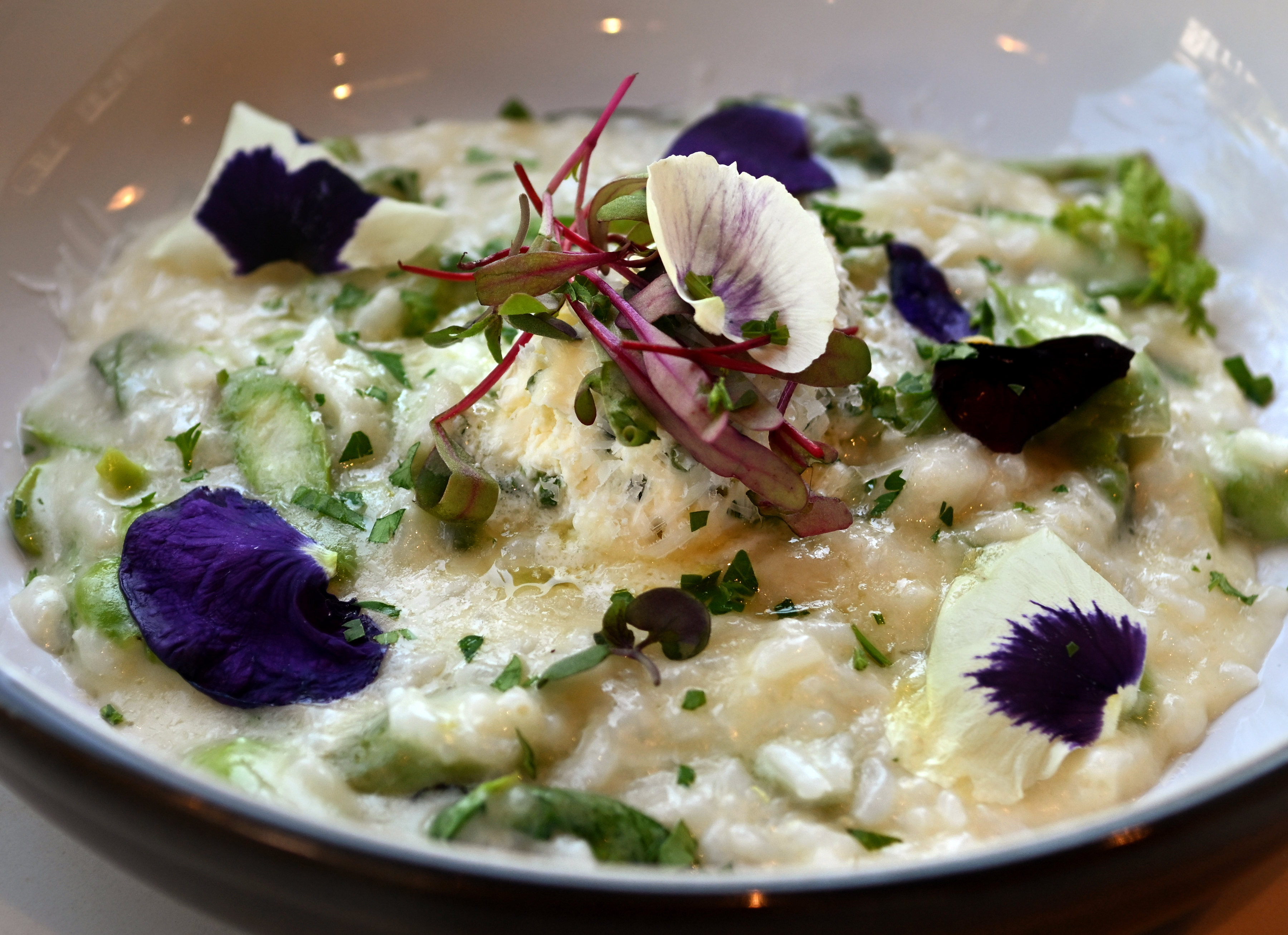 Flower petals garnish the Seasonal Risotto at Cultivar in Sausalito....