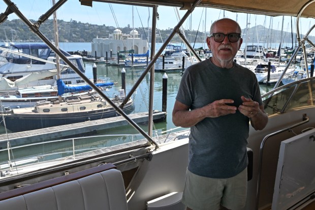 Jacques Elstrom stands aboard his boat in Pelican Harbour in Sausalito, Calif., on Monday, May 11, 2026. (Alan Dep/Marin Independent Journal)