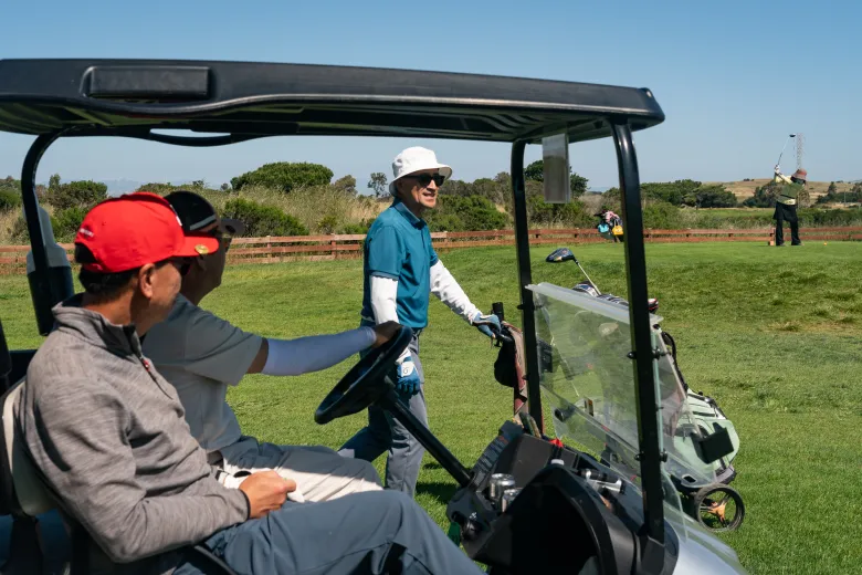 Men playing golf