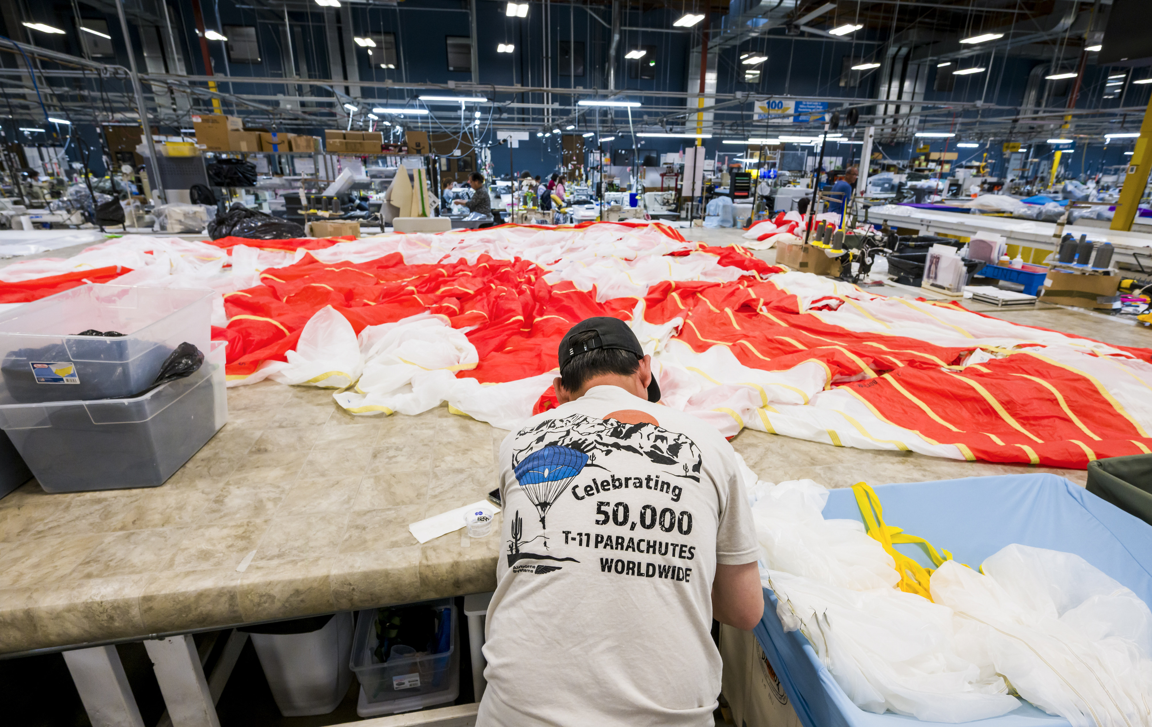 An employee works on one of the three canopies for...