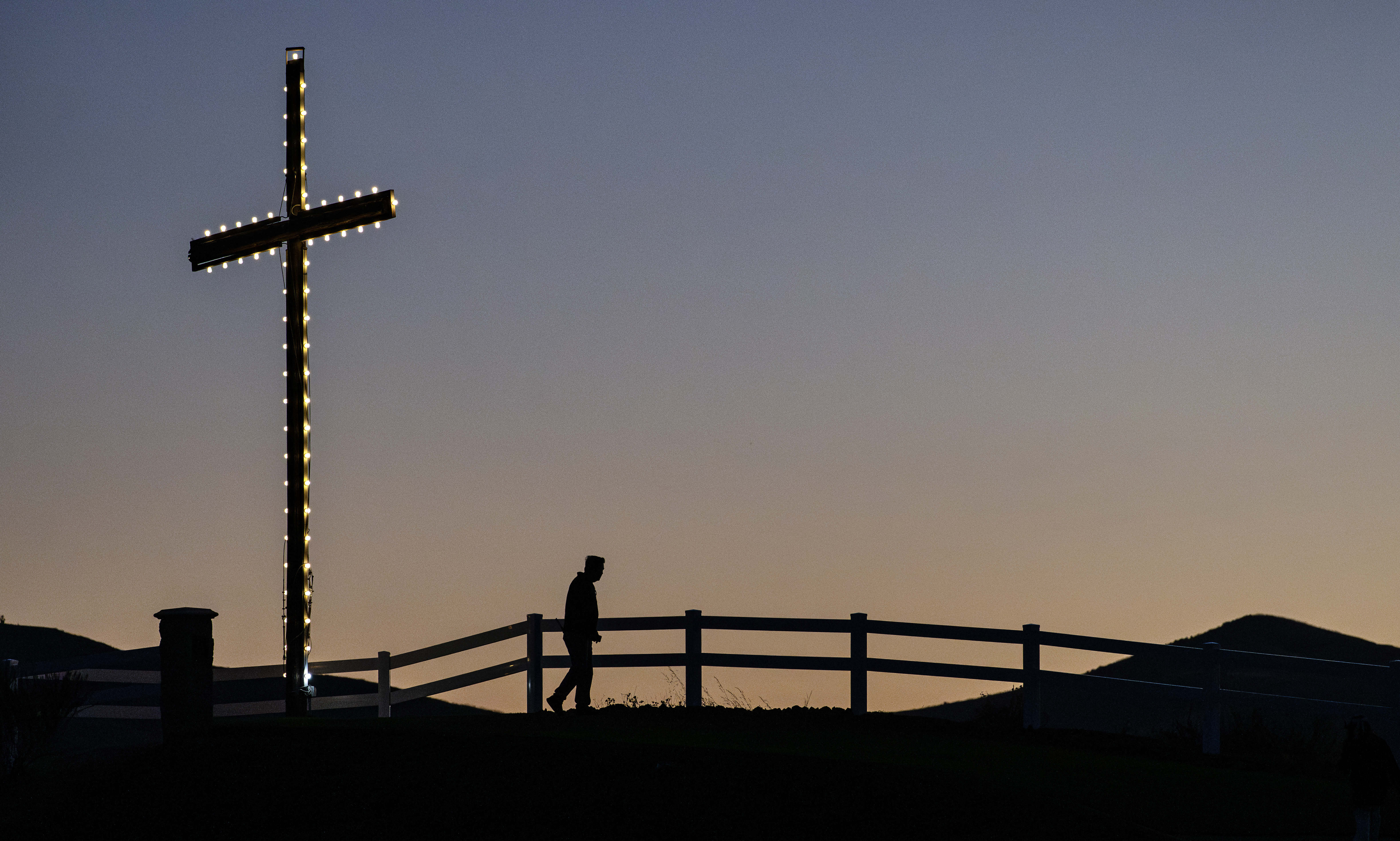 The sun rises over Kindred Churchâs iconic cross during Easter...