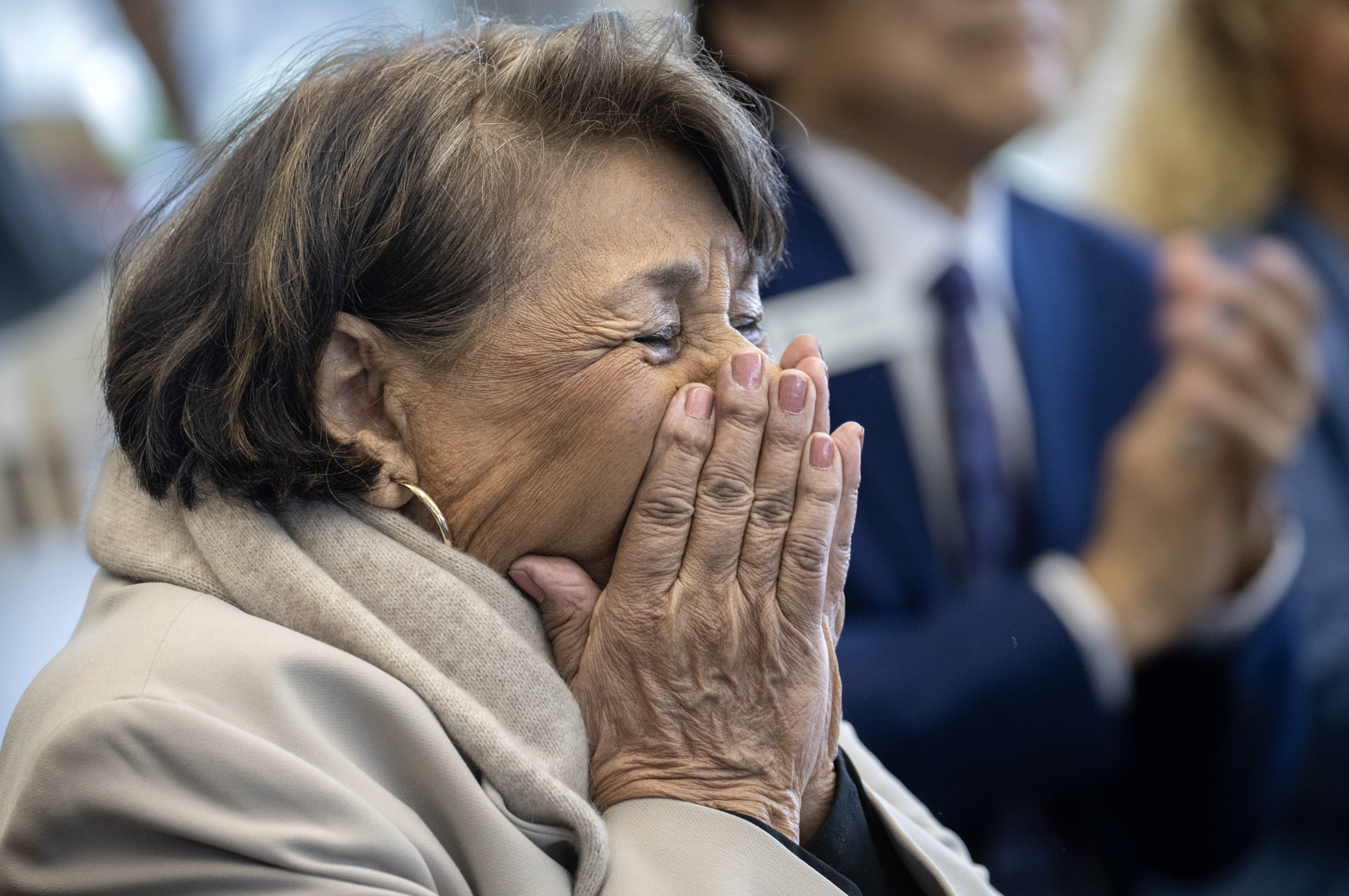 Sylvia Mendez is overcome with emotion during a press conference...