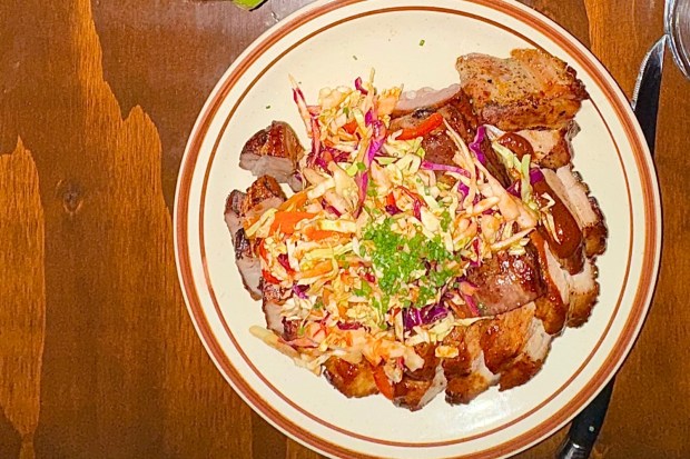 Le Hut Dinette's pork belly chop. (Photo by Brock Keeling, Orange County Register/SCNG)