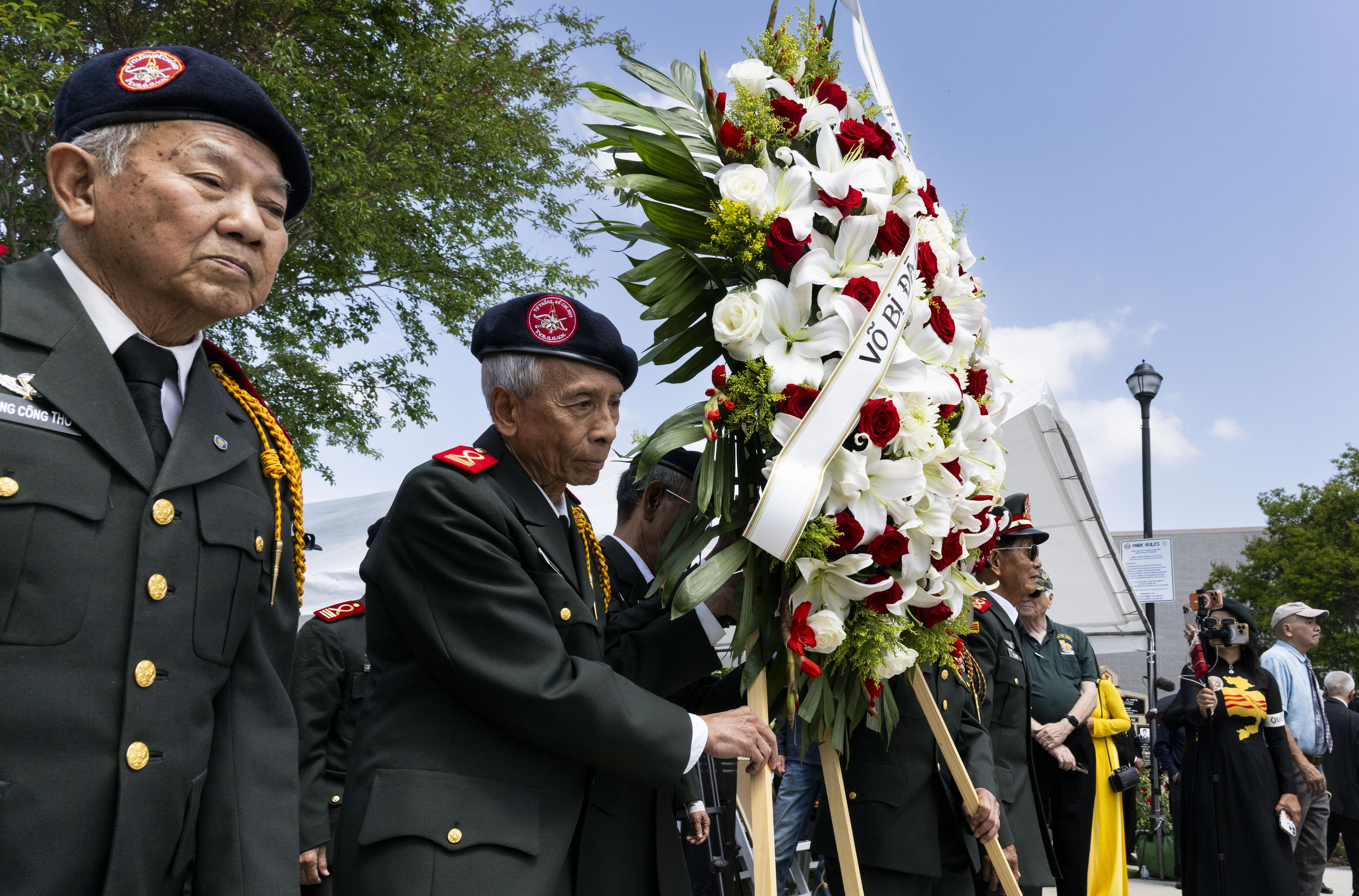 Alumni of the Vietnamese National Military Academy present a wreath...