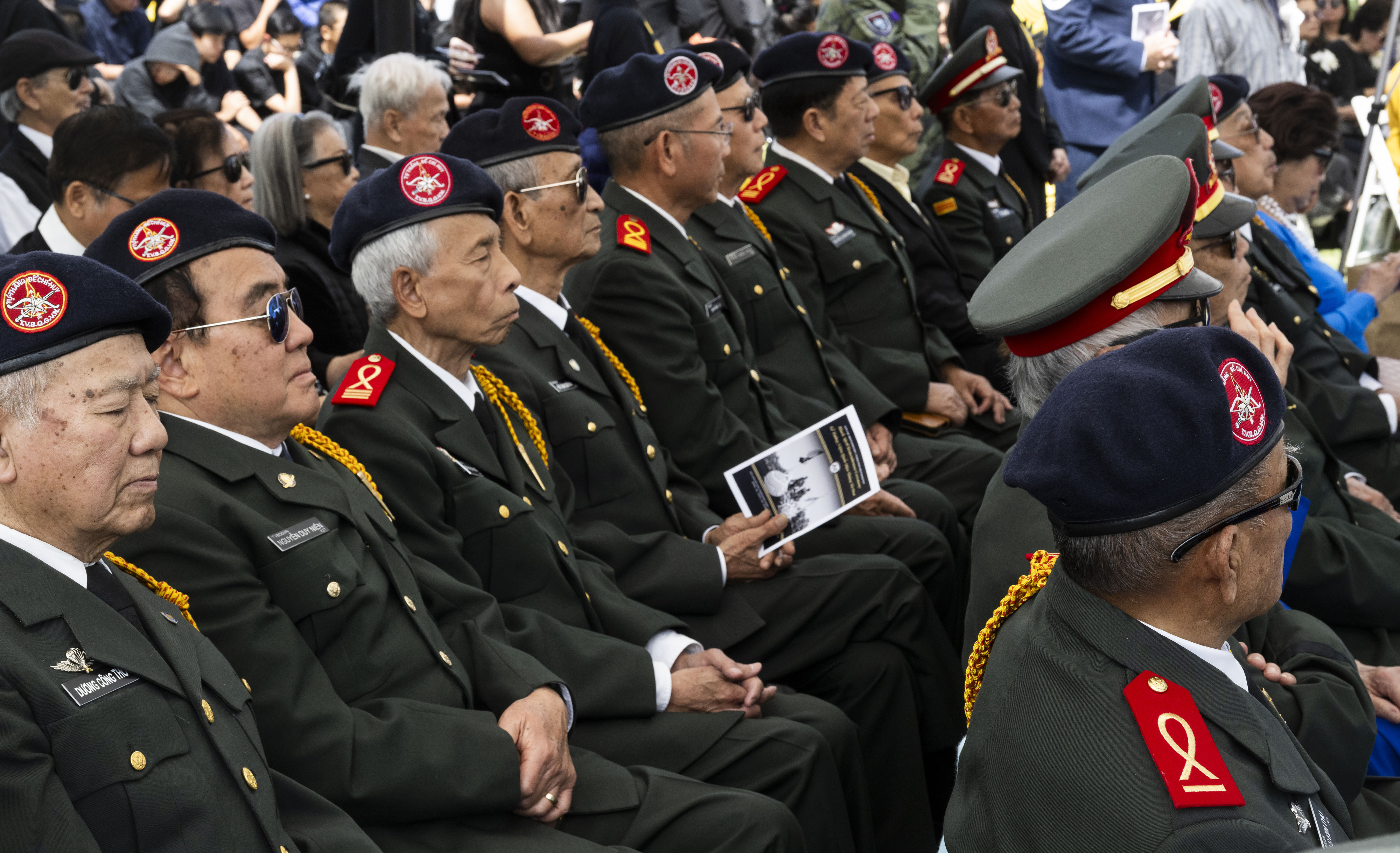 Audience members listen to speakers during a Black April Remembrance...