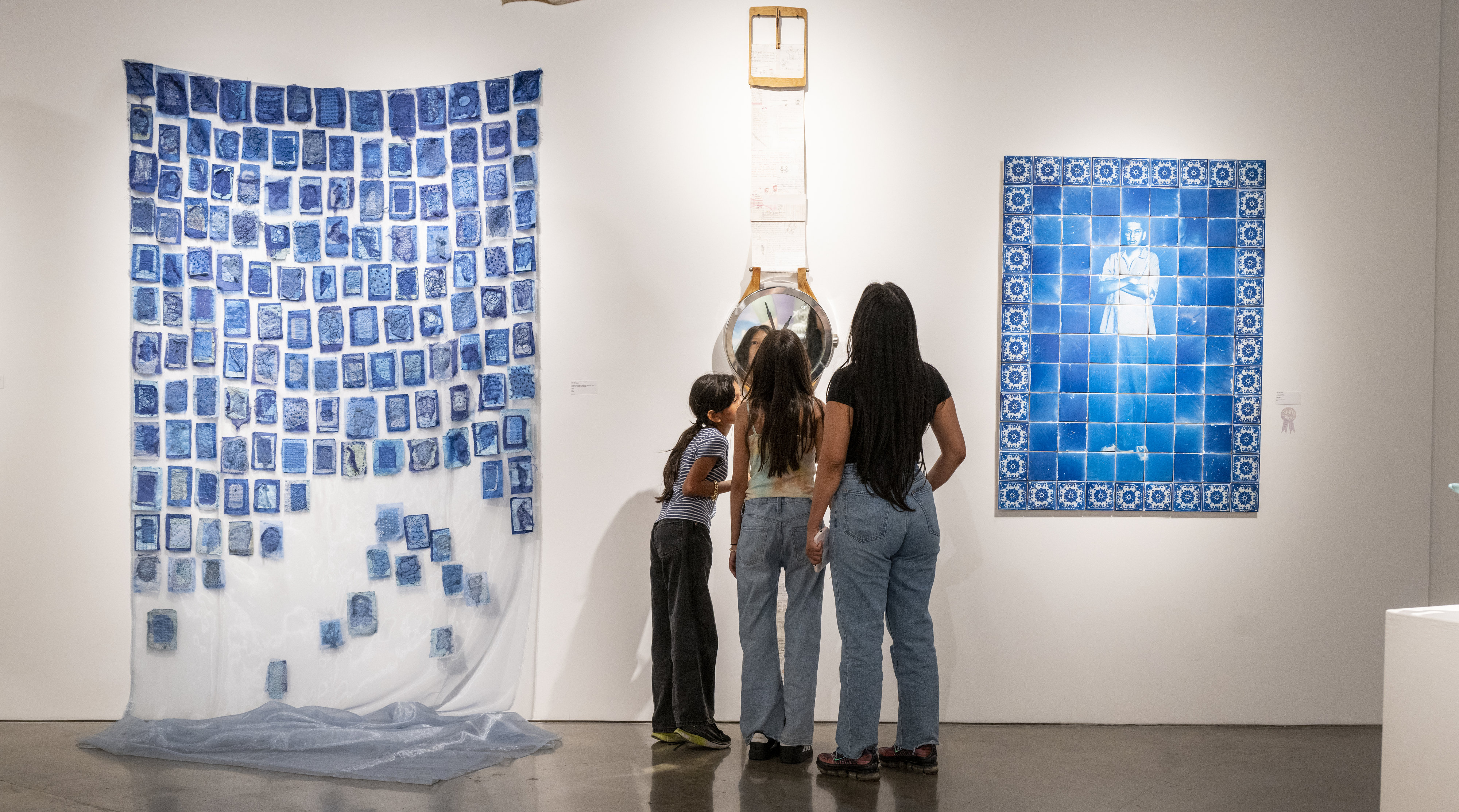 Visitors view art at the âMade in Californiaâ exhibit at...