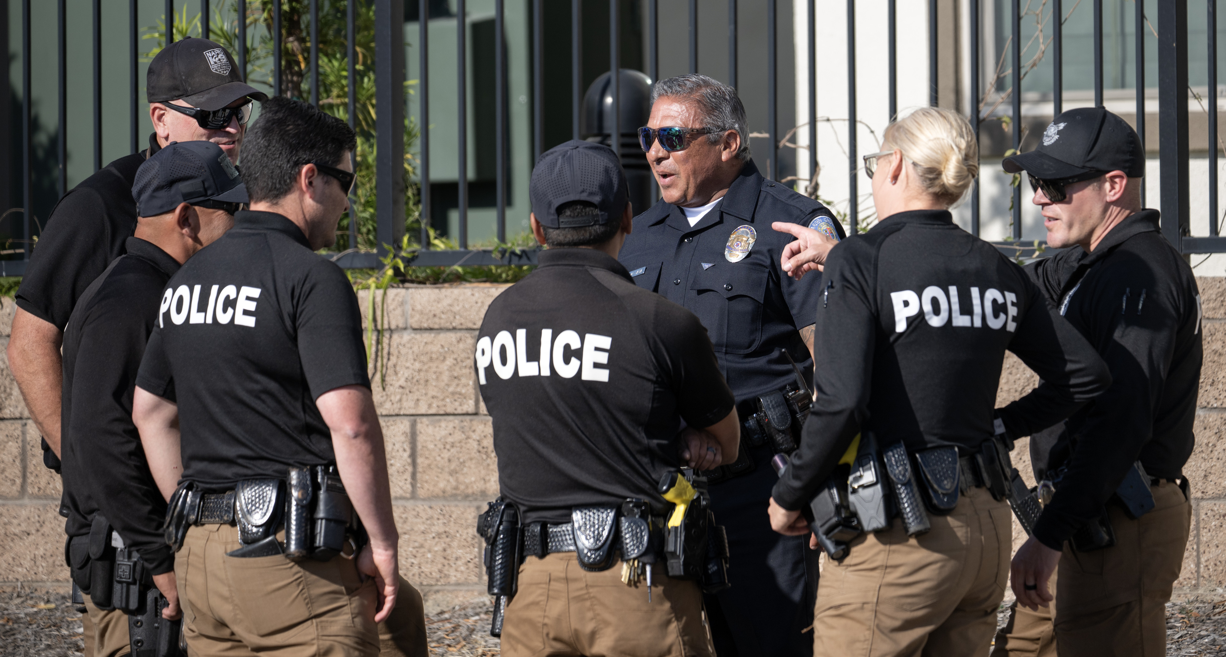 Police gather at the Los Alamitos Command Center on Sunday,...