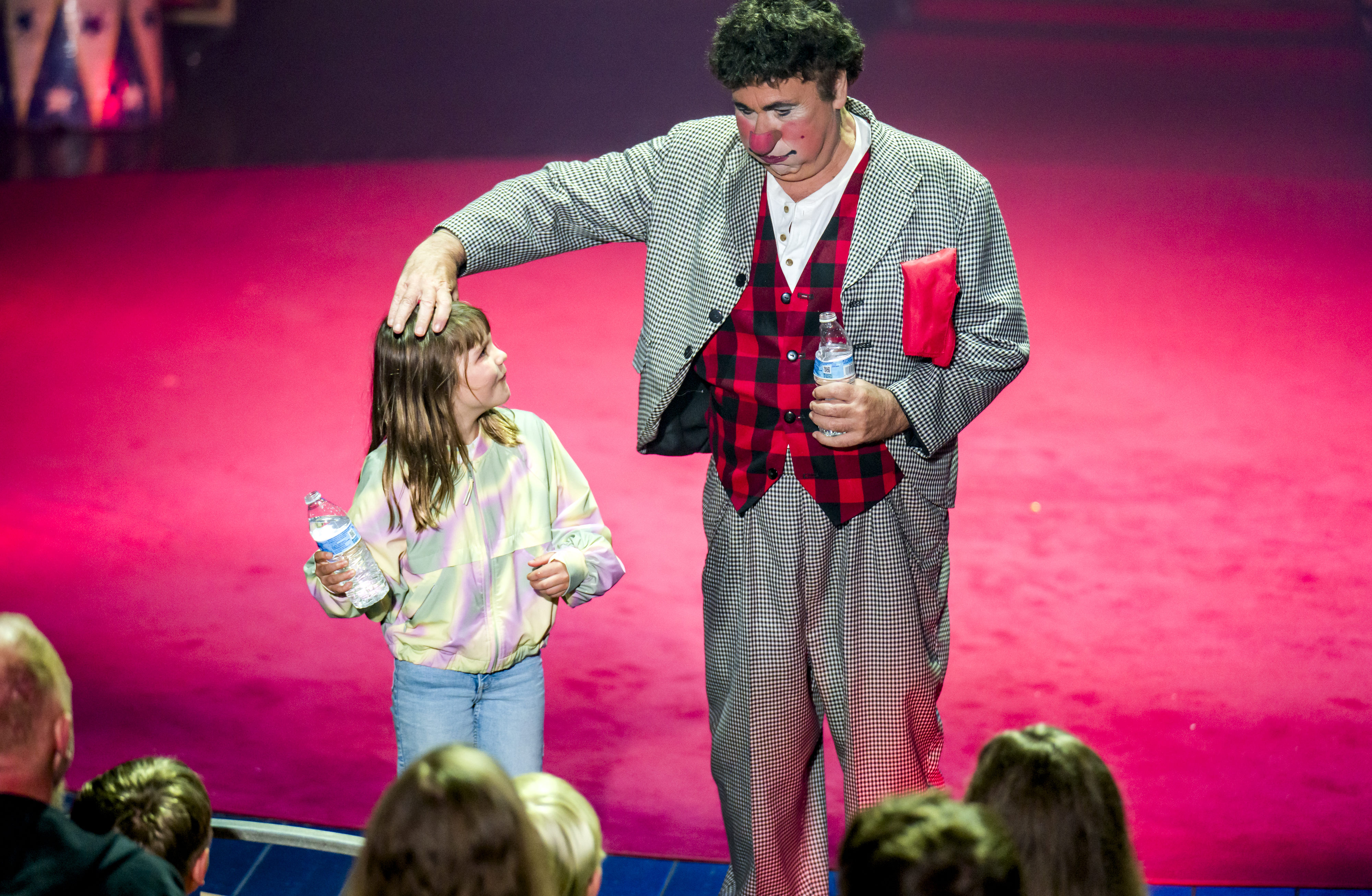 Elle Keith, 8, left, of Laguna Niguel reacts as Circus...