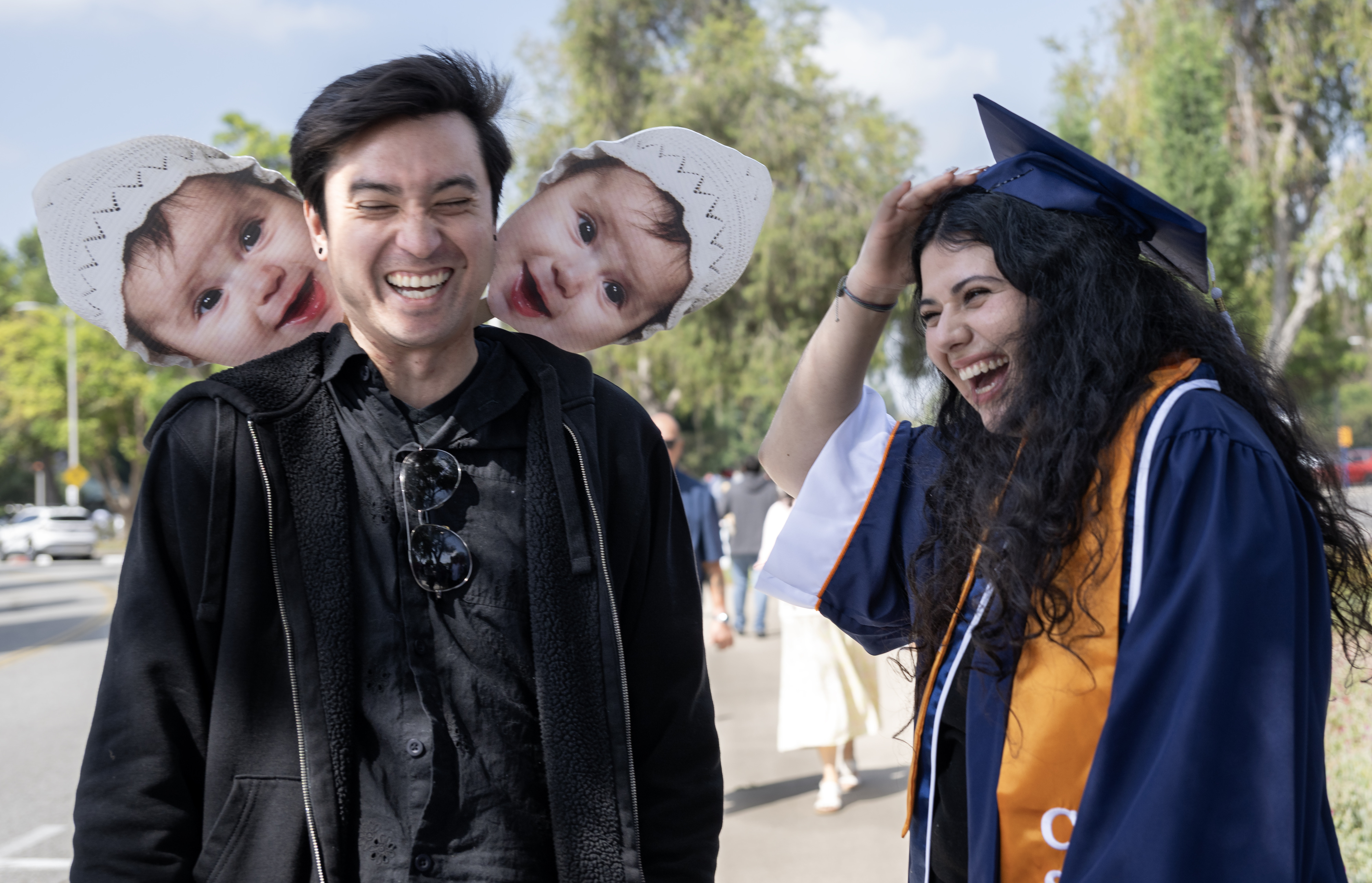 Devin Nykiel surprises Cal State Fullerton graduate Kabella Moll with...