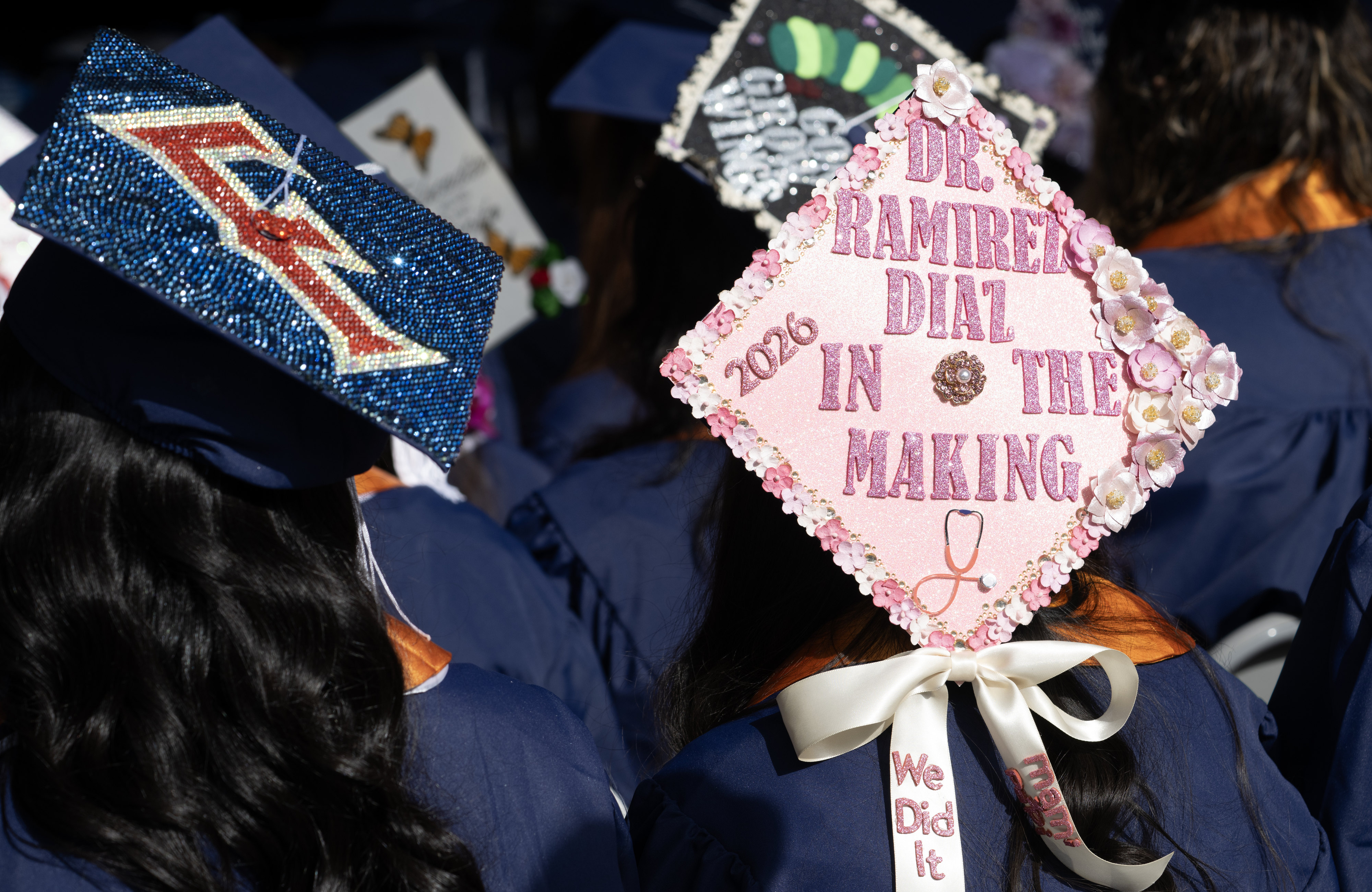 Messages on mortarboards get creative for the Cal State Fullerton...