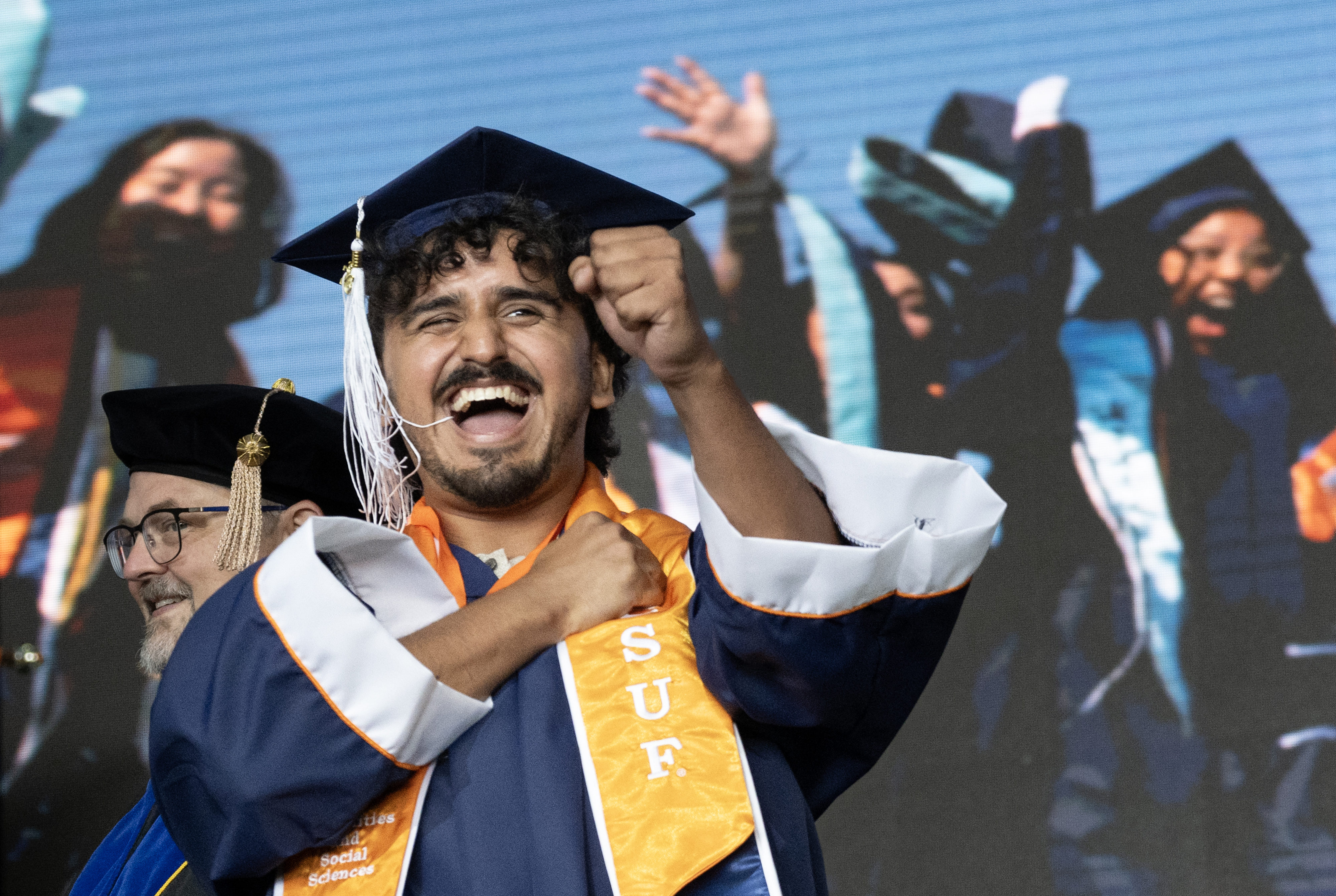 Matthew Rodolfo Garcia does a happy dance on stage during...