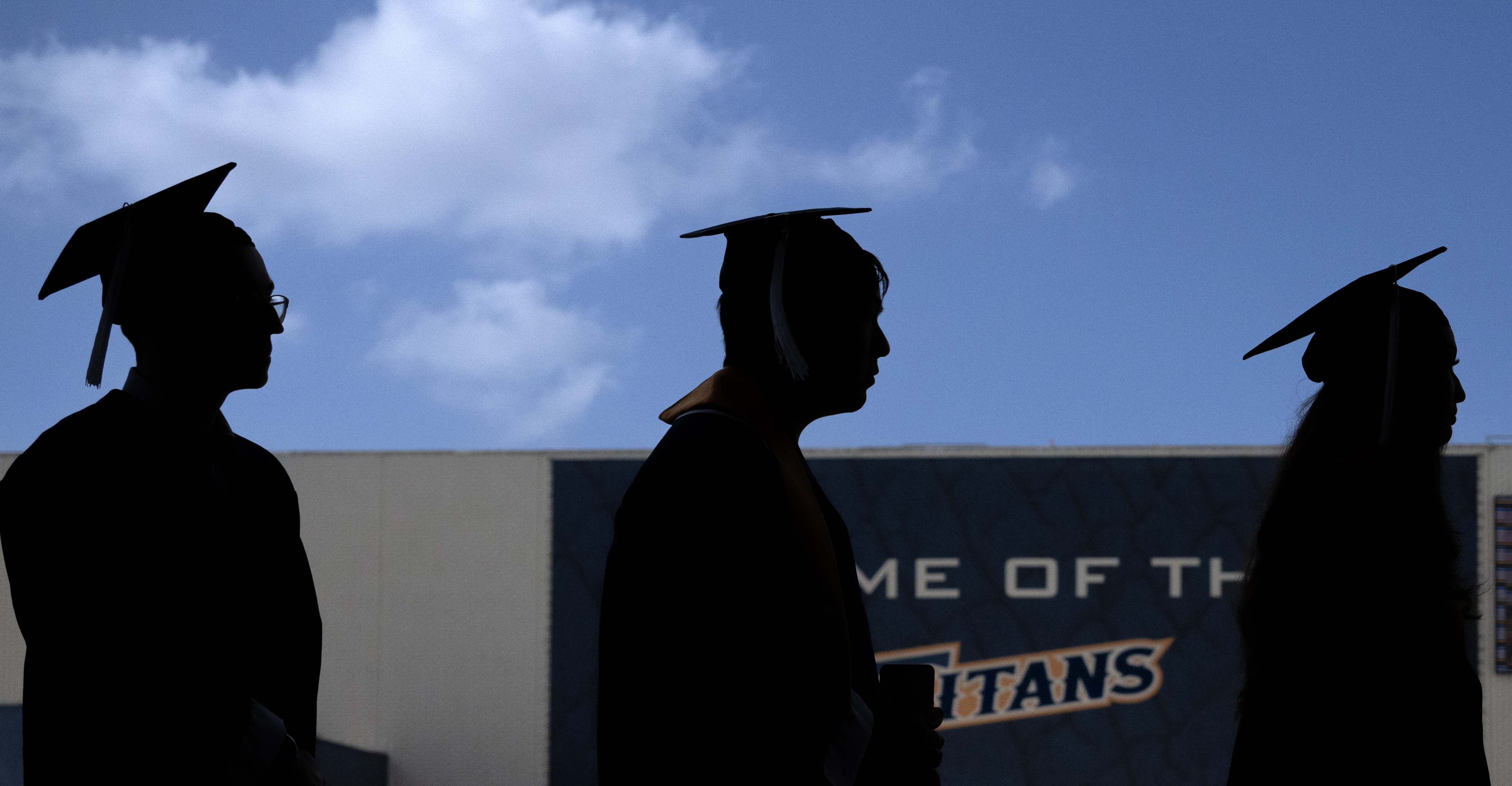 Students form a line to receive their diplomas during Cal...