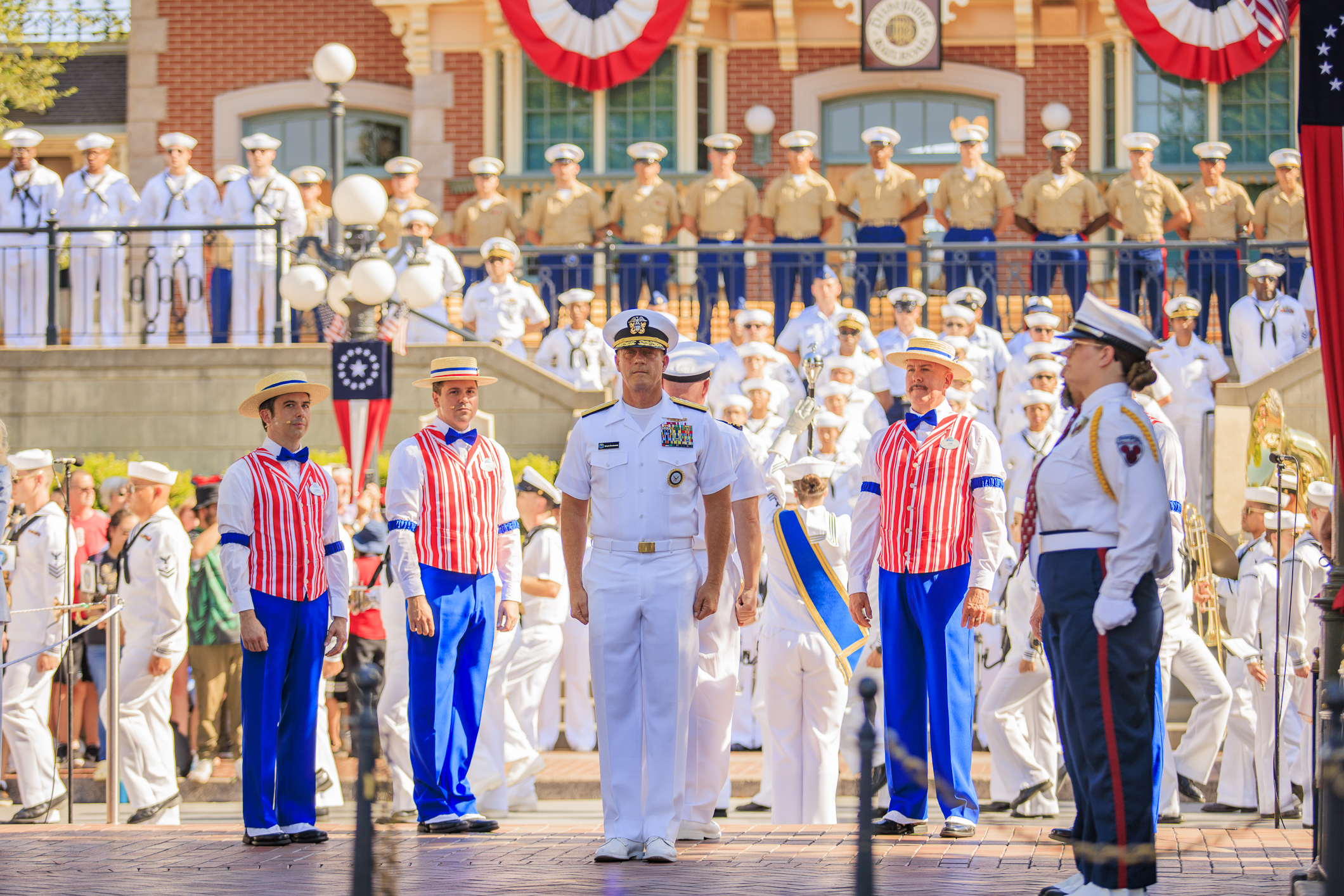 U.S. Sailors, Marines and Coast Guardsmen during a flag retreat...