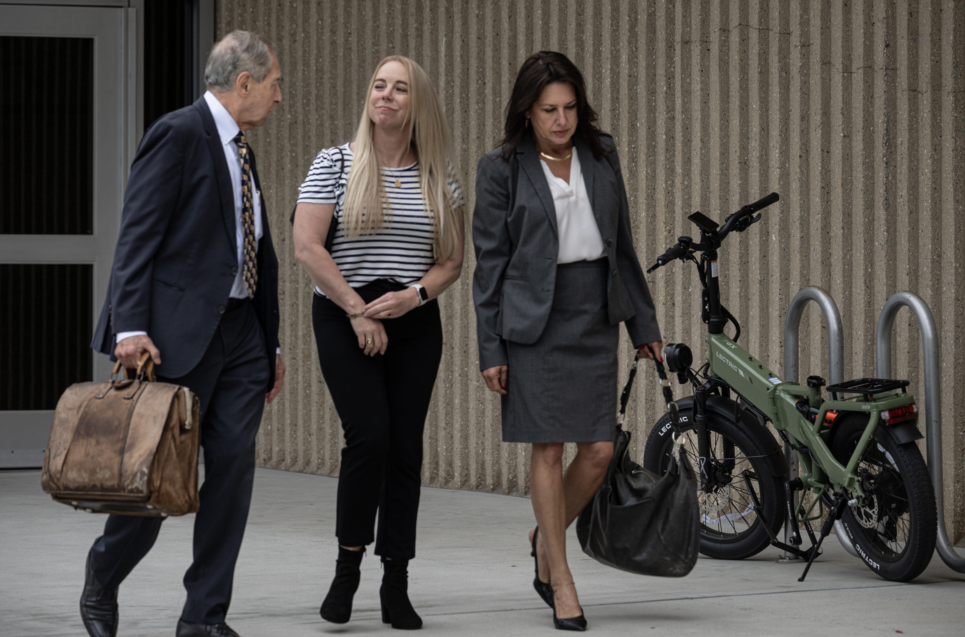 Tommi Jo Mejer, center, the mother of a 14-year-old accused...