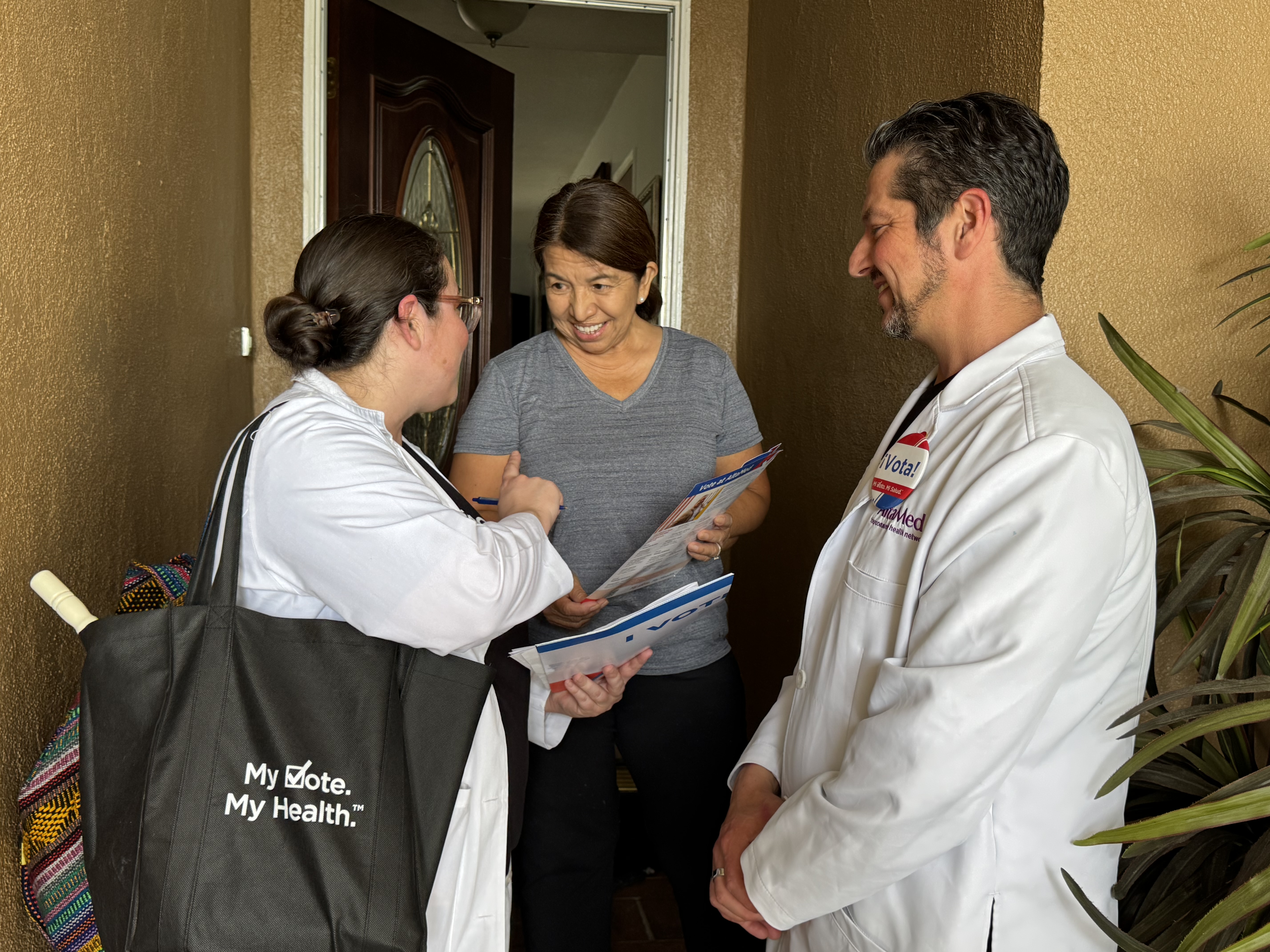 Dr. Regina Inchizu speaks with Santa Ana resident Judith Hernandez...