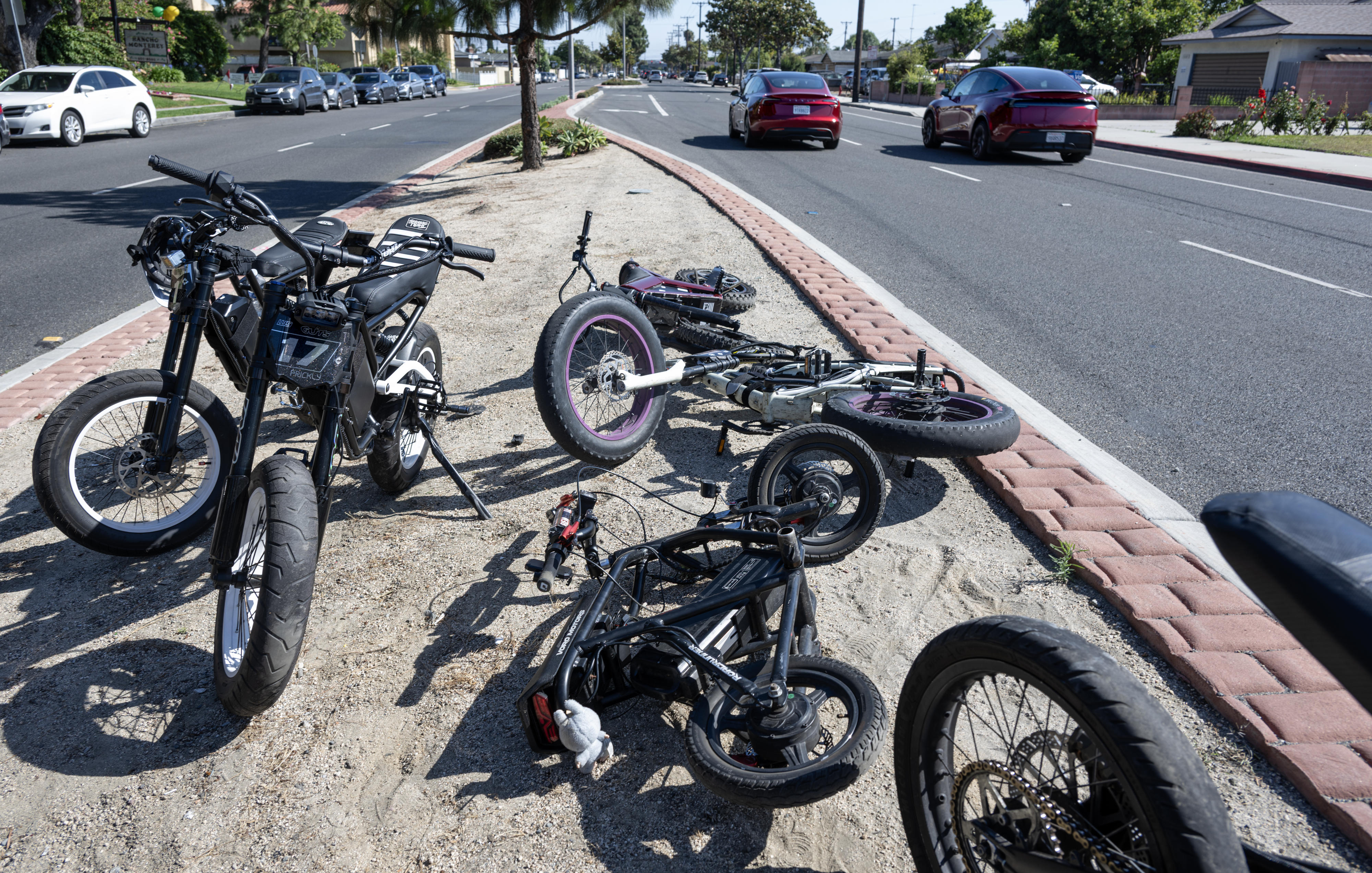 E-riders park their bikes on the median at Magnolia Street...